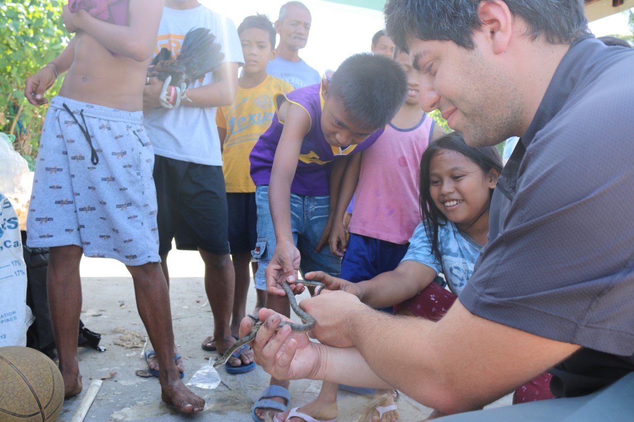 Helping individuals identify a dog-faced water snake from a barangay in Magarao, Camarines Sur, Philippines. (2019)