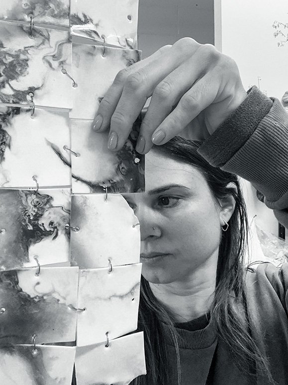 Anna assembling her tile work