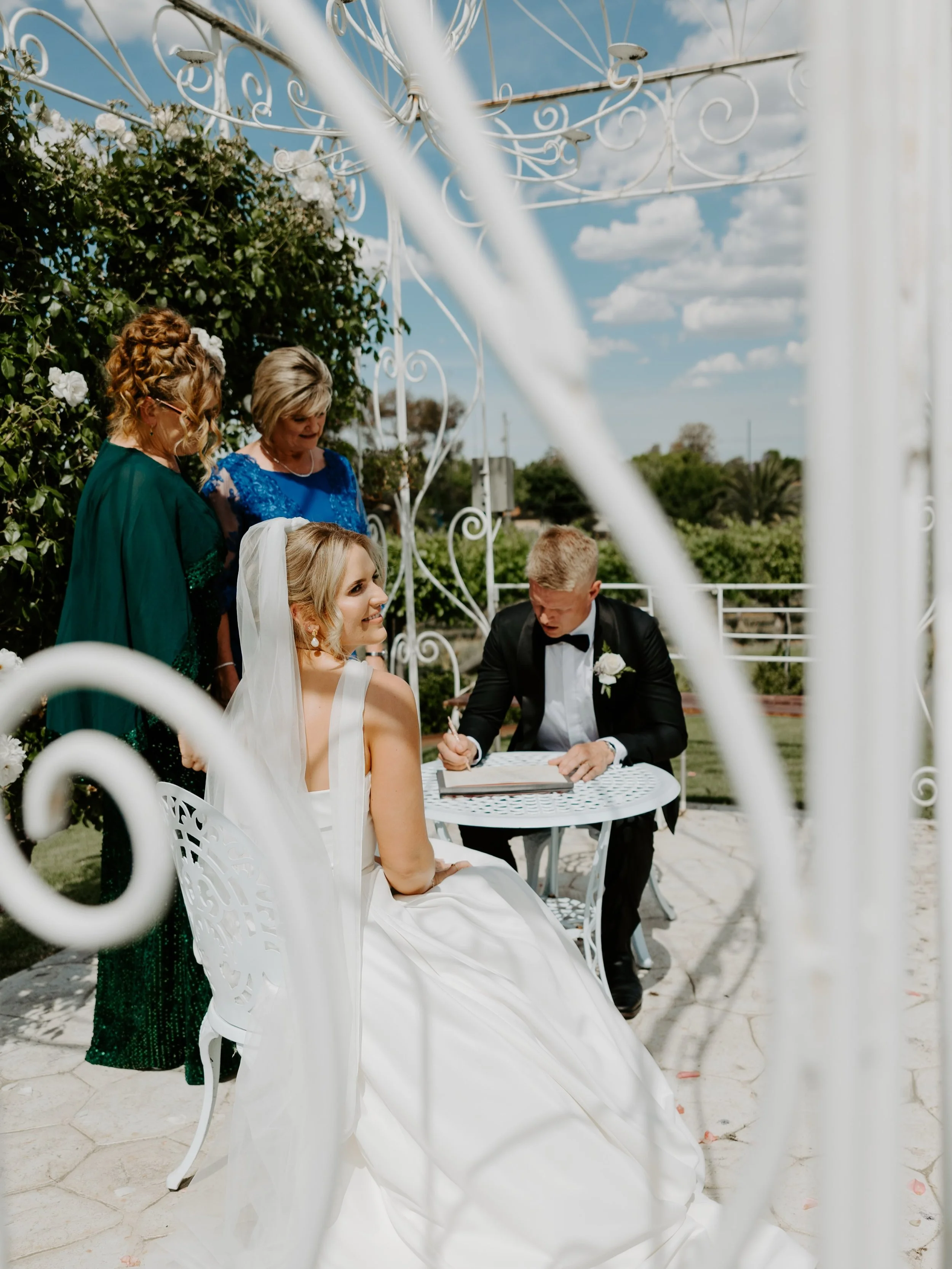 Signing your marriage certificates can be the perfect pause right when you need it. You are about to head into the next part of your day. Take a moment to breathe, soak in the moment. You are married now!! 

📷 @weareframefolk