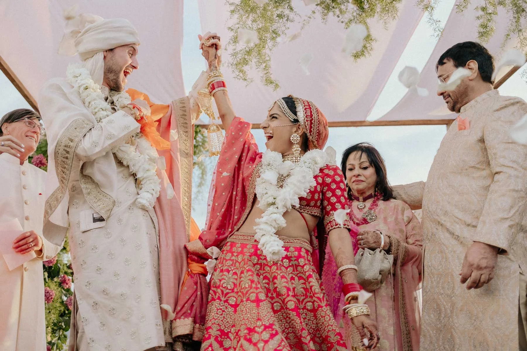 bride and groom elated at their indian wedding in tuscany