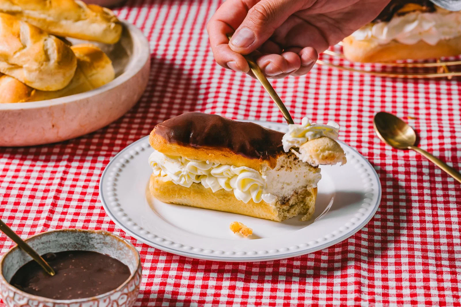 Brioche rolls eclairs, bite, landscape, WEB.jpg