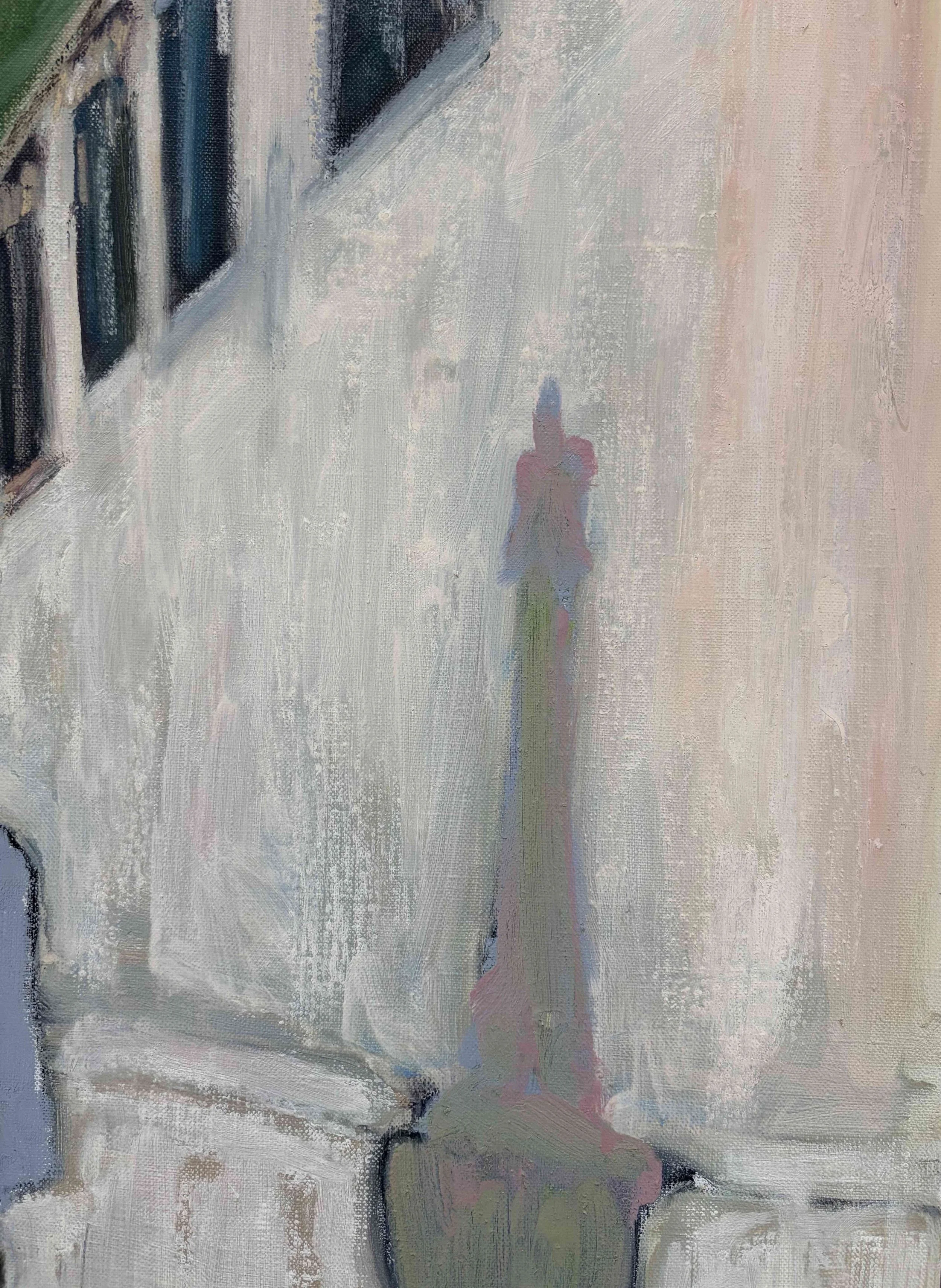 Close-up of a figurative painting showing a tall, slender monument against the pale façade of a building. The monument is rendered in muted pink, green, and blue tones, blending softly into the textured surface of the architecture.