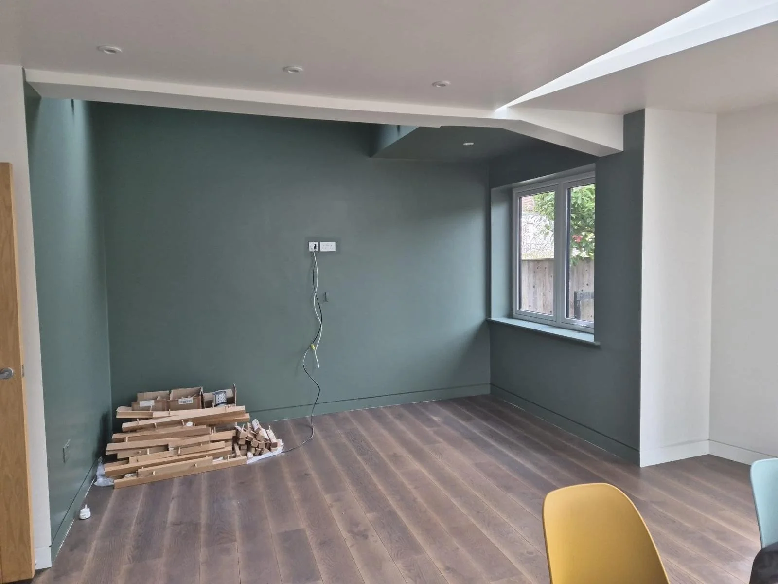 In progress: the sitting area painted a deep green