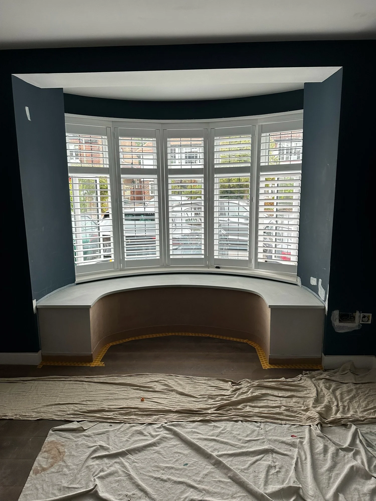 In progress: the window seat fitted into the bay, with navy walls