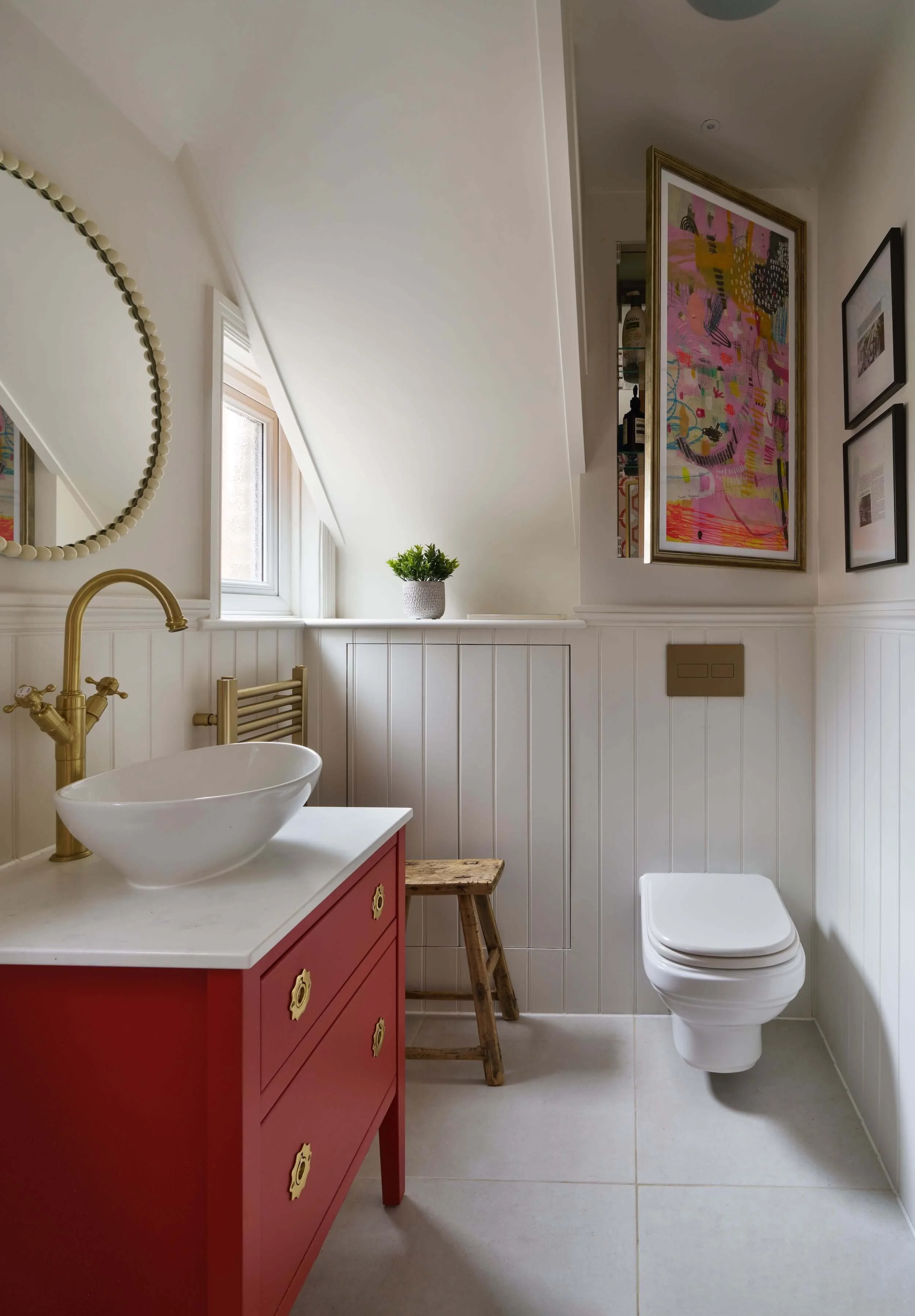 Family bathroom - the cabinet behind the artwork