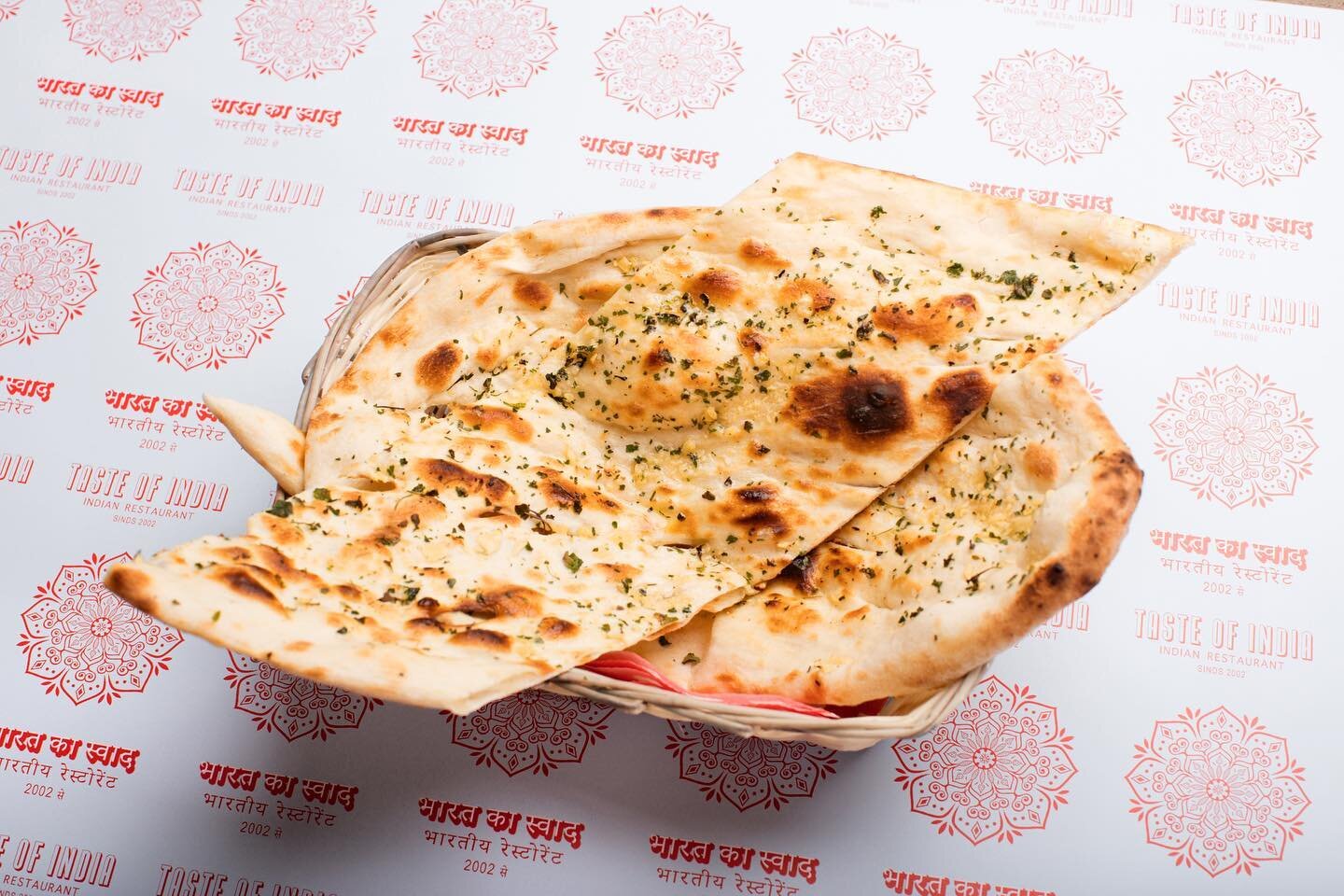 There's nothing like dipping naan
straight out of the tandoor into a delicious curry.
We take naan very seriously, offering seven unique options to
choose from. Which one are you ordering?
* Cheesy Garlic Naan
* Tandoori Roti
* Garlic Naan
* Peshwari