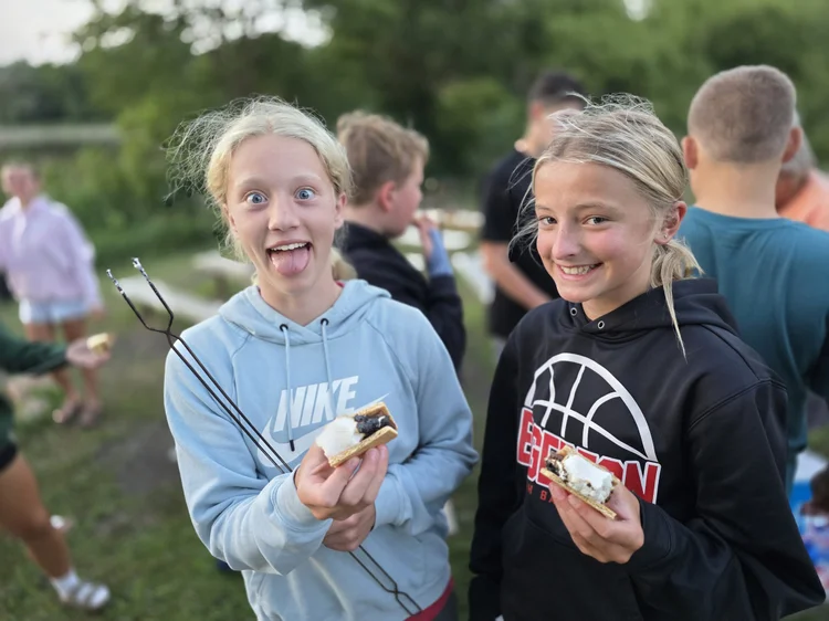 Two students showing off their s
