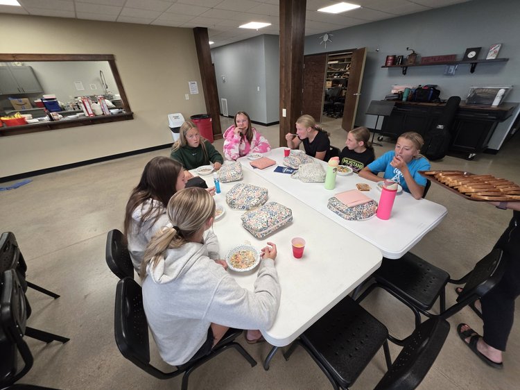 Students eating together at camp