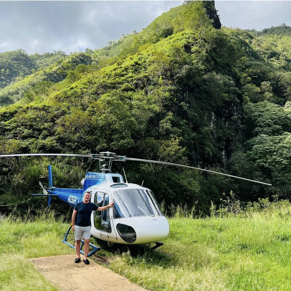 Helicopter landing at waterfall