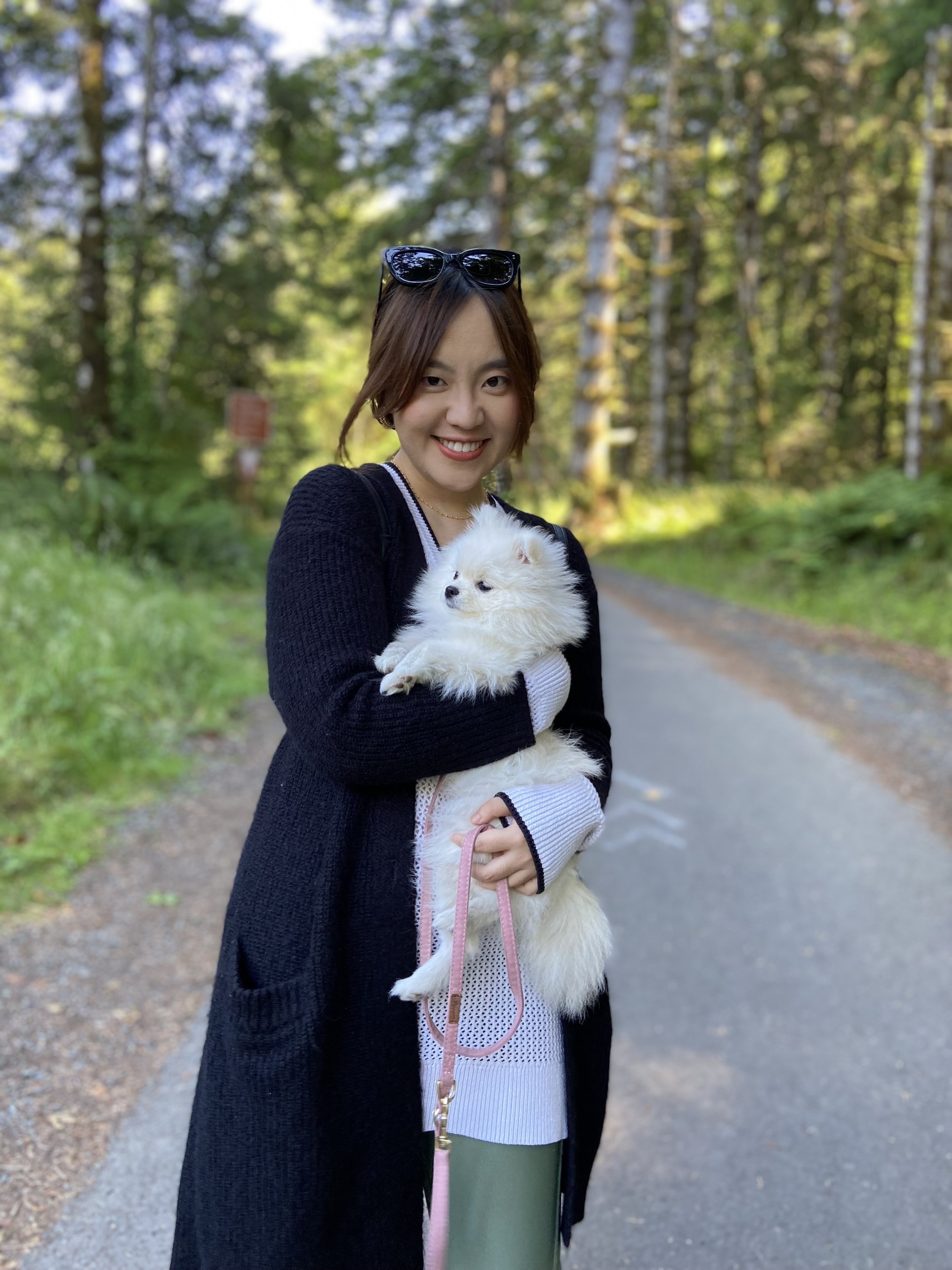 Transformation Life Coach, Effie Cao with a white puppy