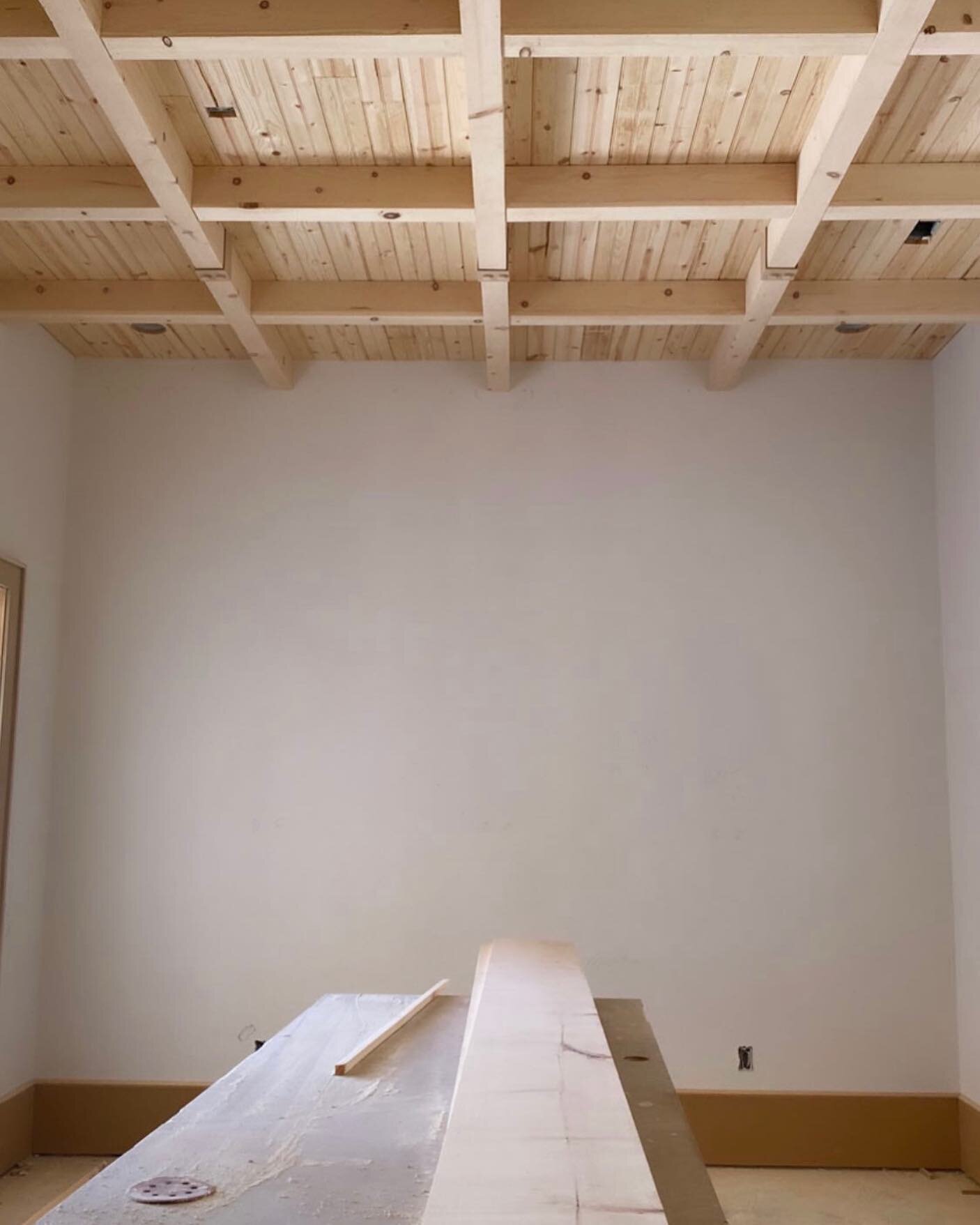 Tongue and groove ceiling details with applied beams.