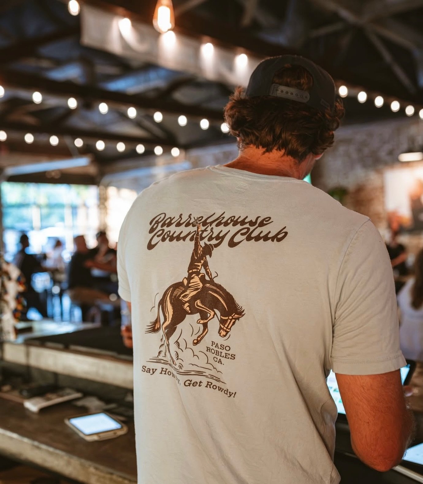 Cold beer in hand, good music playing, boots a little dusty, and some damn good people around you.

The BarrelHouse Country Club Ride &rsquo;Em Tee fits right in. Soft light blue, a little western, and made for the people who make this place what it 