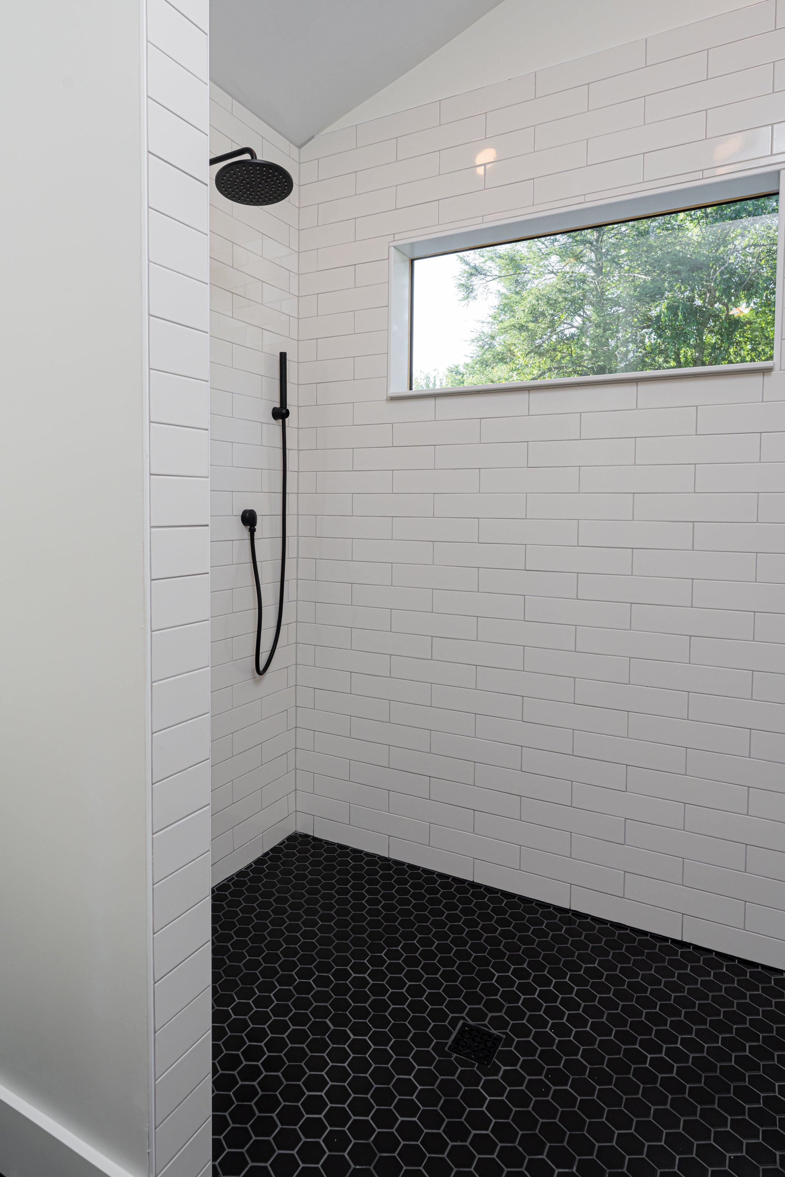 Construction by Lobo Builders - Photo by Ryan Theede Photography - Asheville Interior Design - Bungalow Renovation - Beautiful Zero Entry Shower