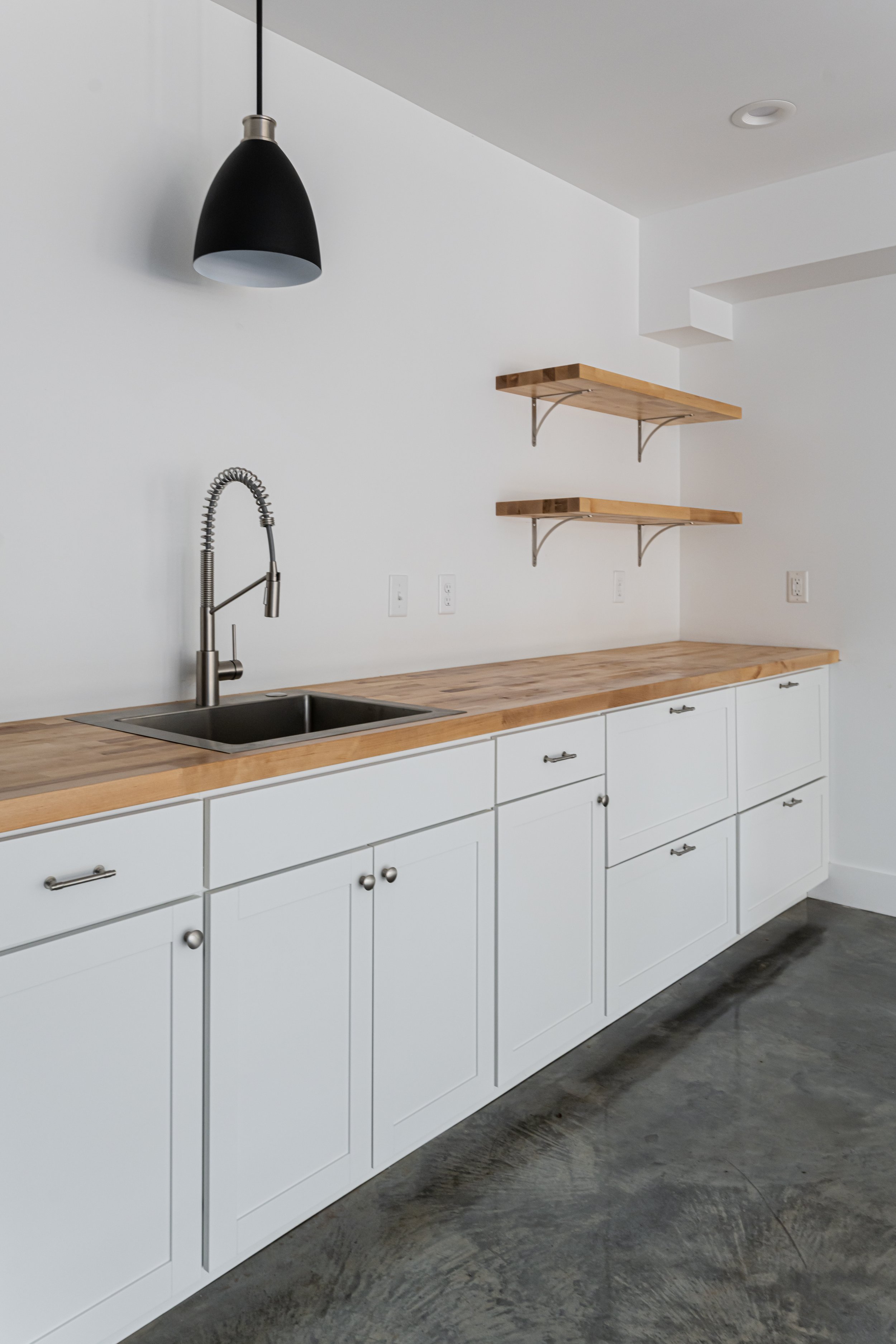 Asheville Interior Design - Modern Basement Kitchenette Pendant Light + Concrete Floors