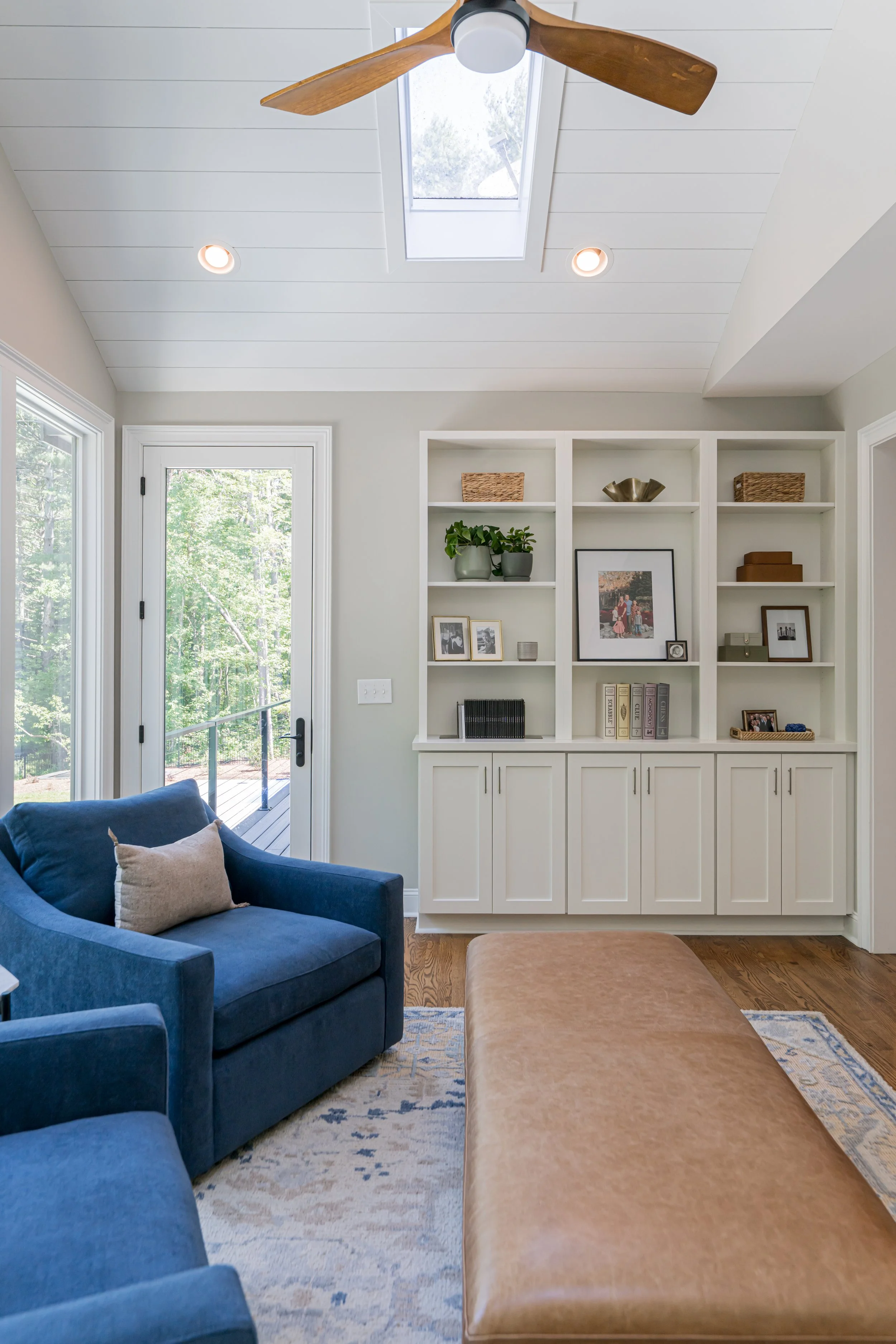 Photo by Ryan Theede Photography - Asheville Interior Design; Classic meets modern sunroom with custom built-ins