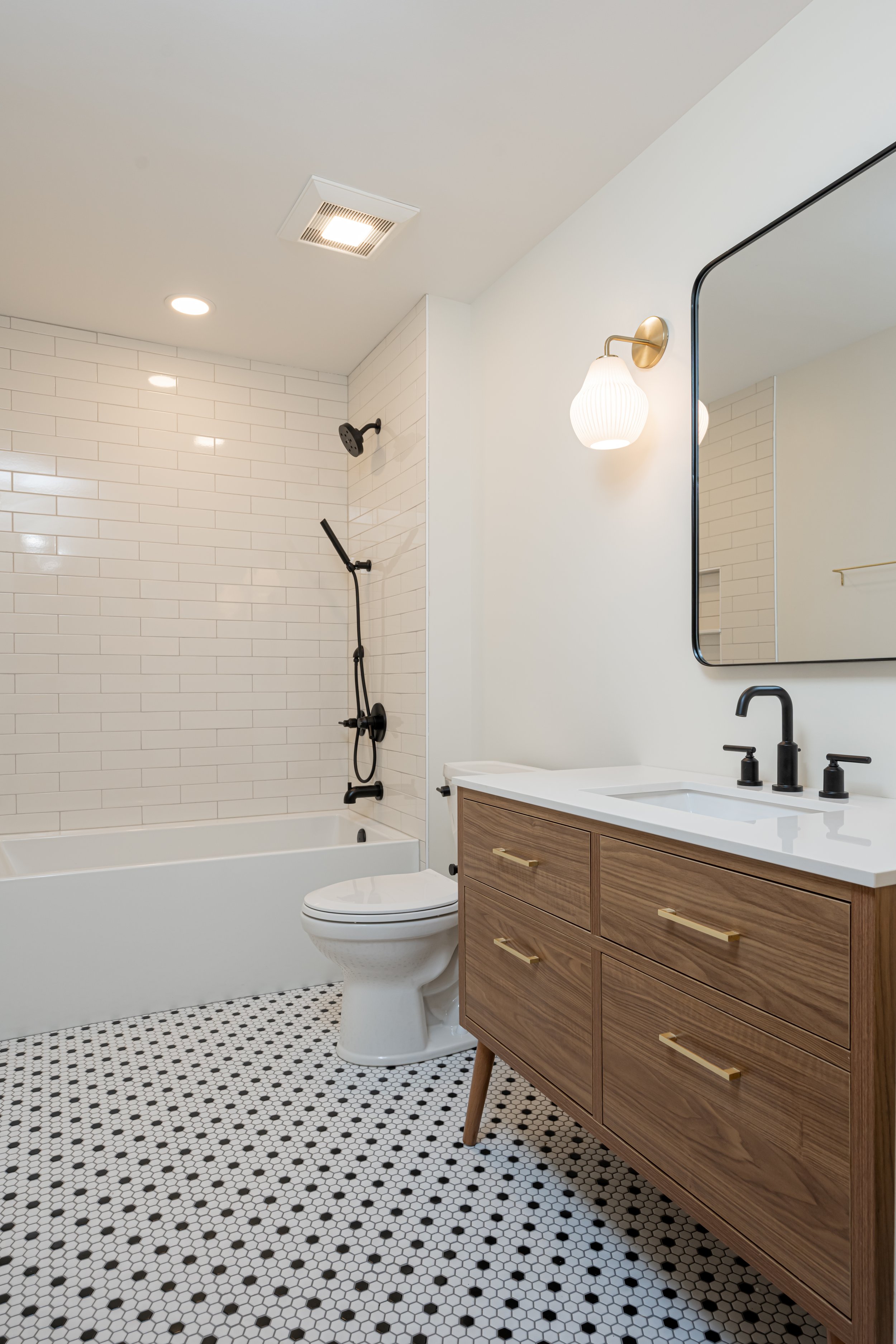 Construction by Lobo Builders - Photo by Ryan Theede Photography - Asheville Interior Design - Bungalow Renovation - Classic tile + Midcentury Bathroom