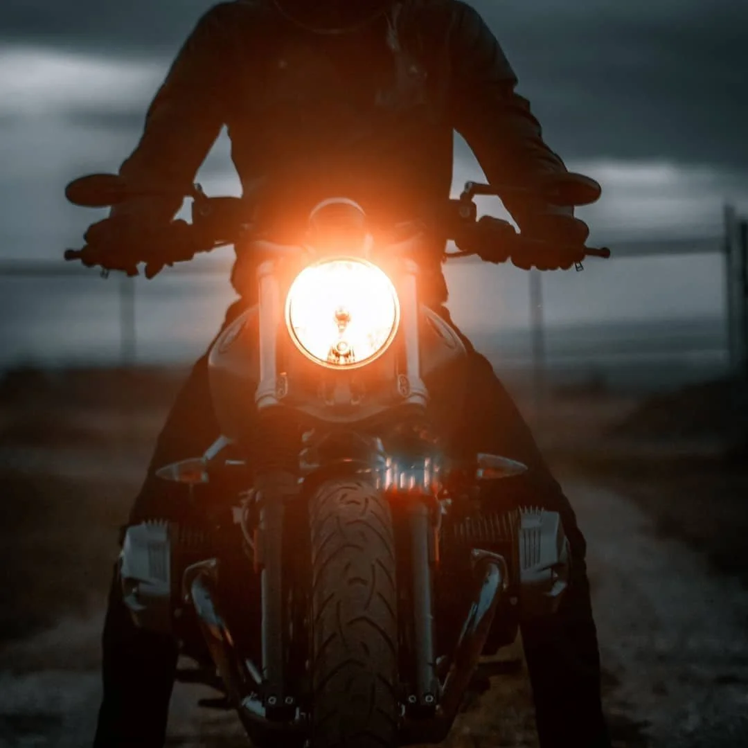 Headlight shot of BMW R Nine T motorcycle at dusk | Edmonton motorcycle photographer DarkShark Media