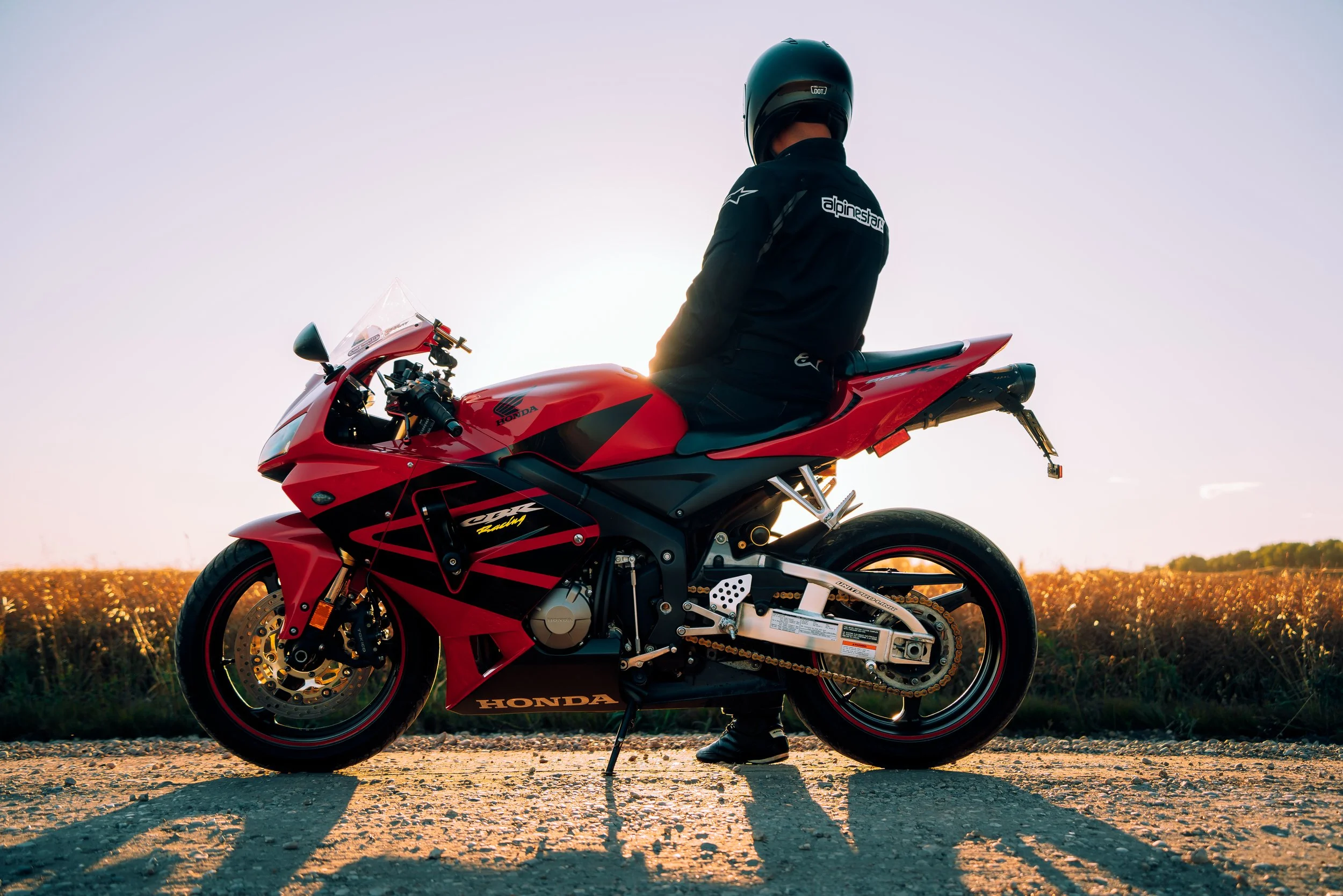 Motorcycle rider rests on his bike | Edmonton motorcycle photographer DarkShark Media