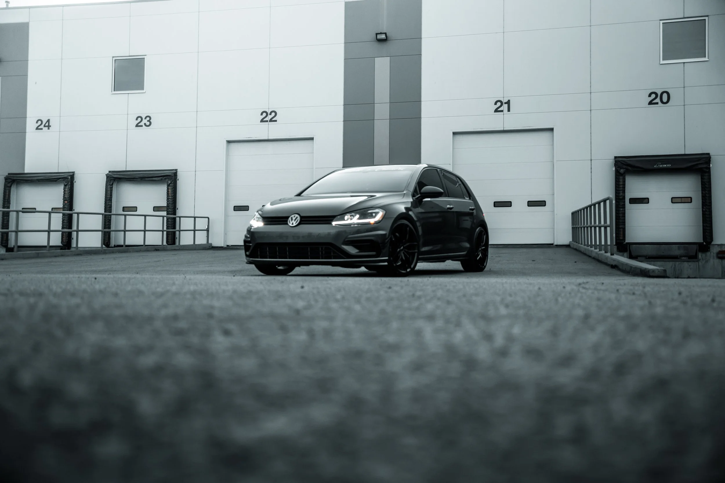 Volkswagen Golf parked in front of warehouse | Edmonton automotive photographer DarkShark Media