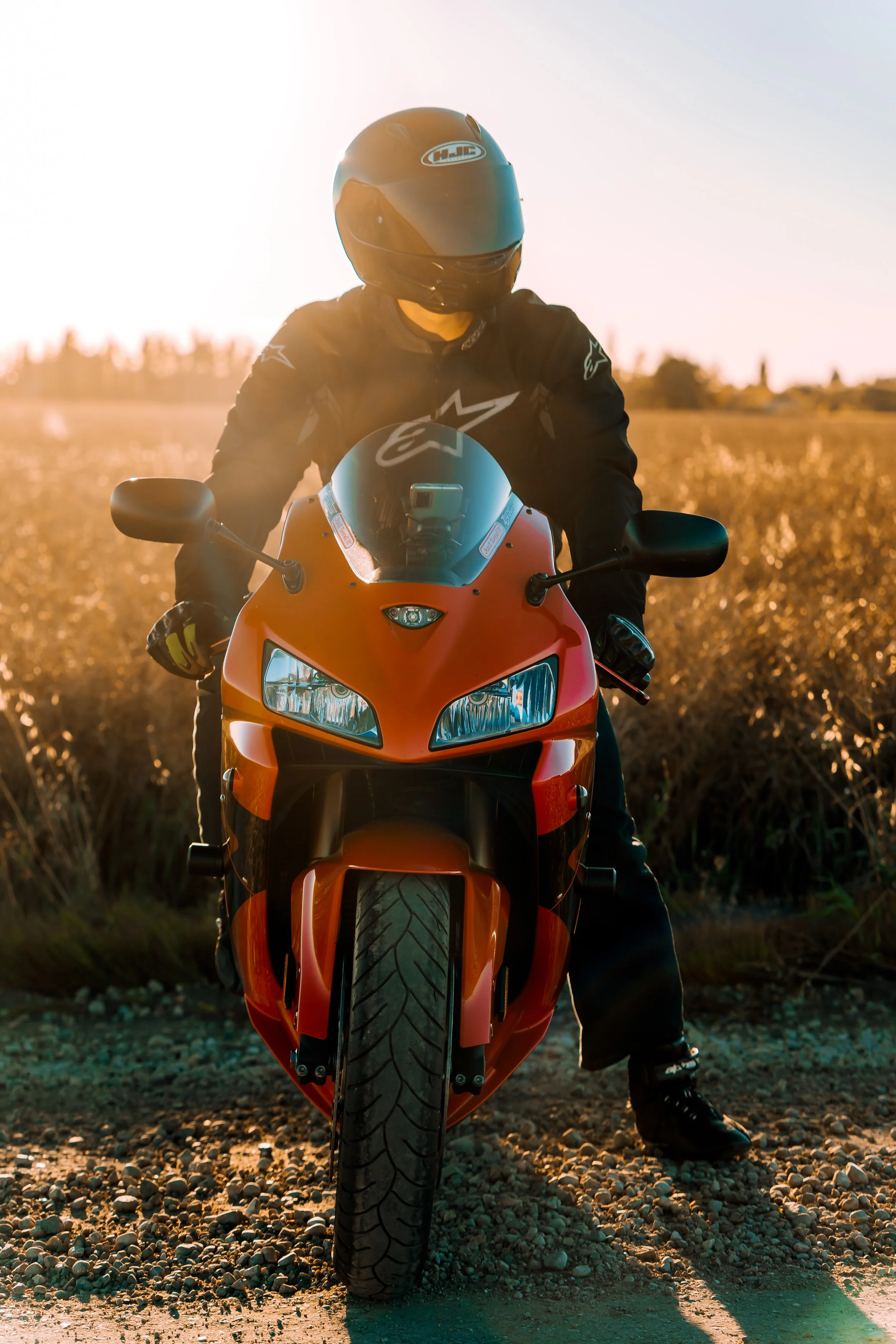Man in black Alpinestars jacket sits on CBR motorcycle | Edmonton motorcycle photographer DarkShark Media