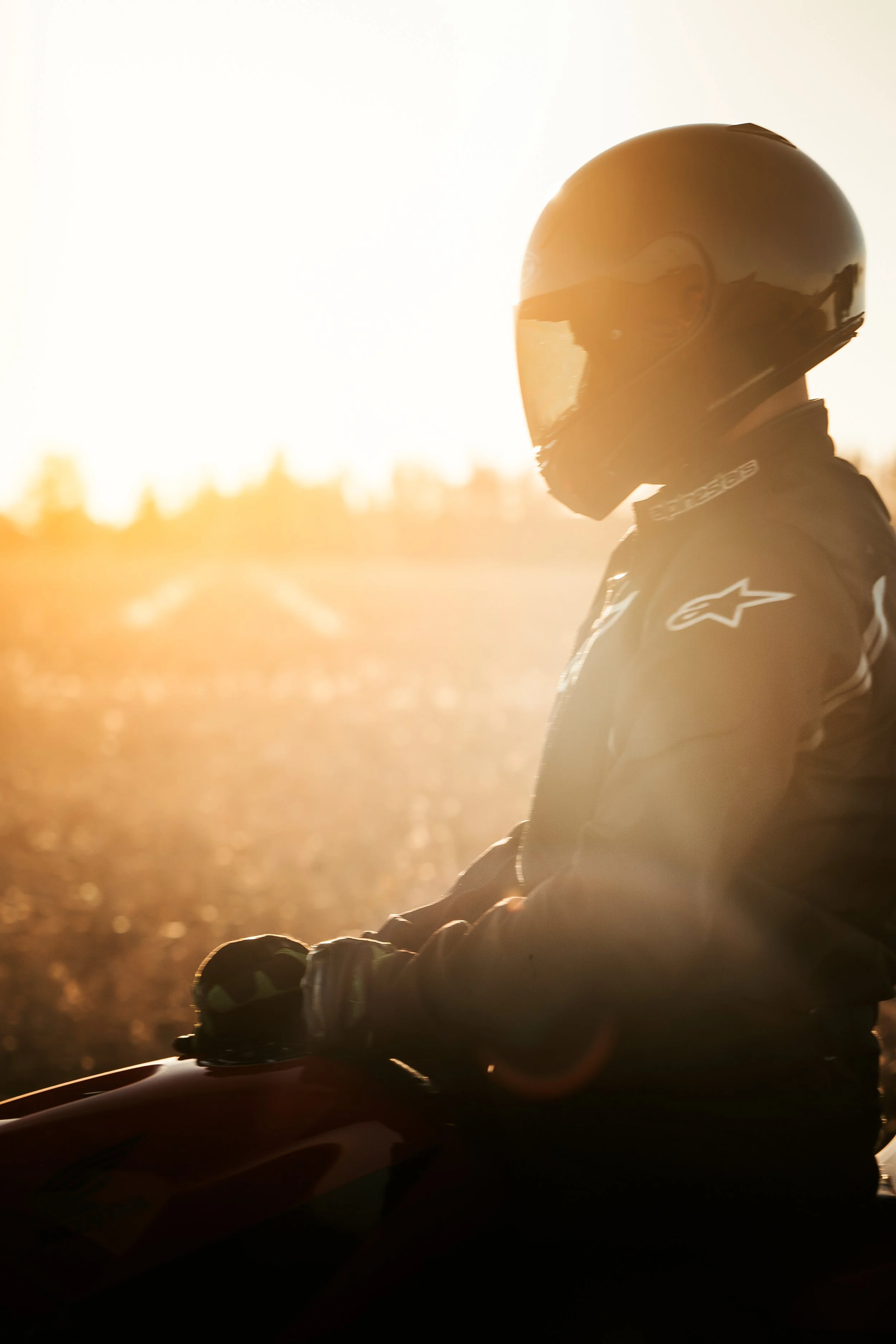 Motorcycle apparel model in gear at sunset | Edmonton motorcycle photographer DarkShark Media