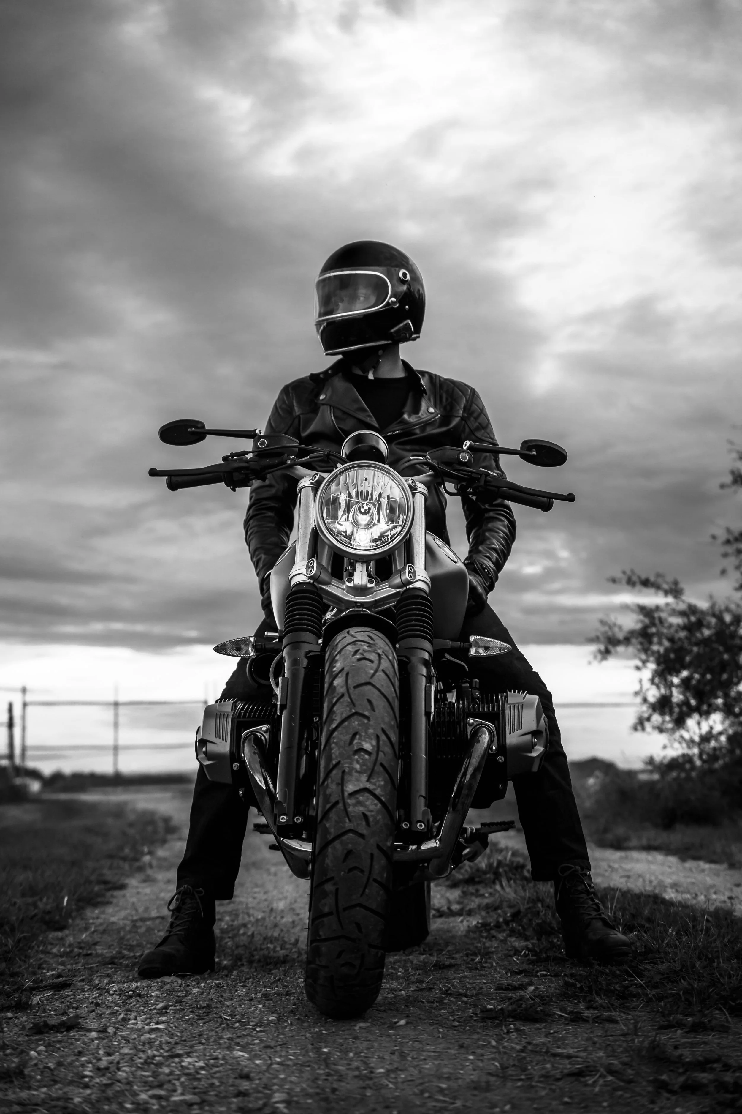 Dramatic black and white image of man sitting on motorcycle | Edmonton motorcycle photographer DarkShark Media