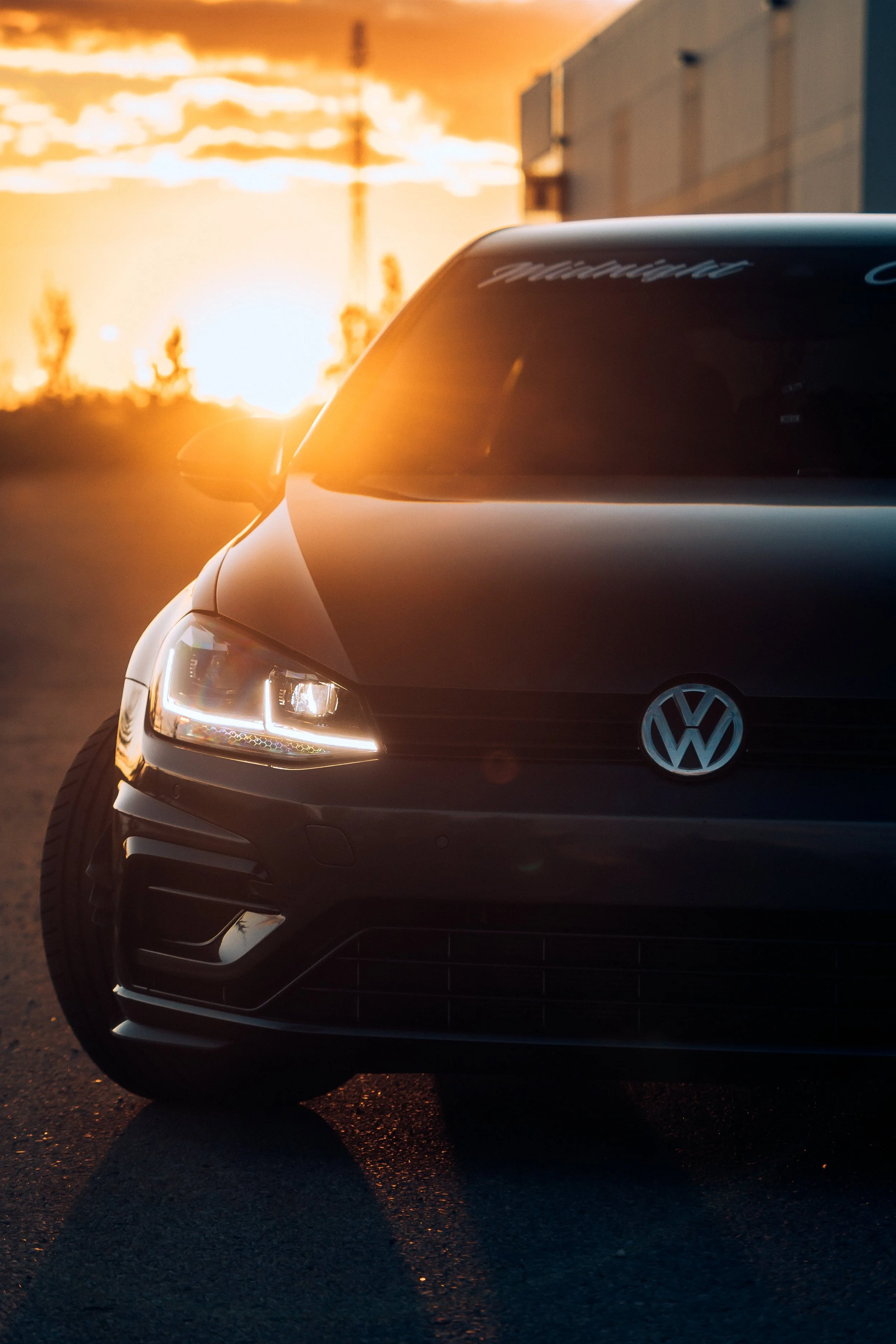 Volkswagen car parked in front of setting sun