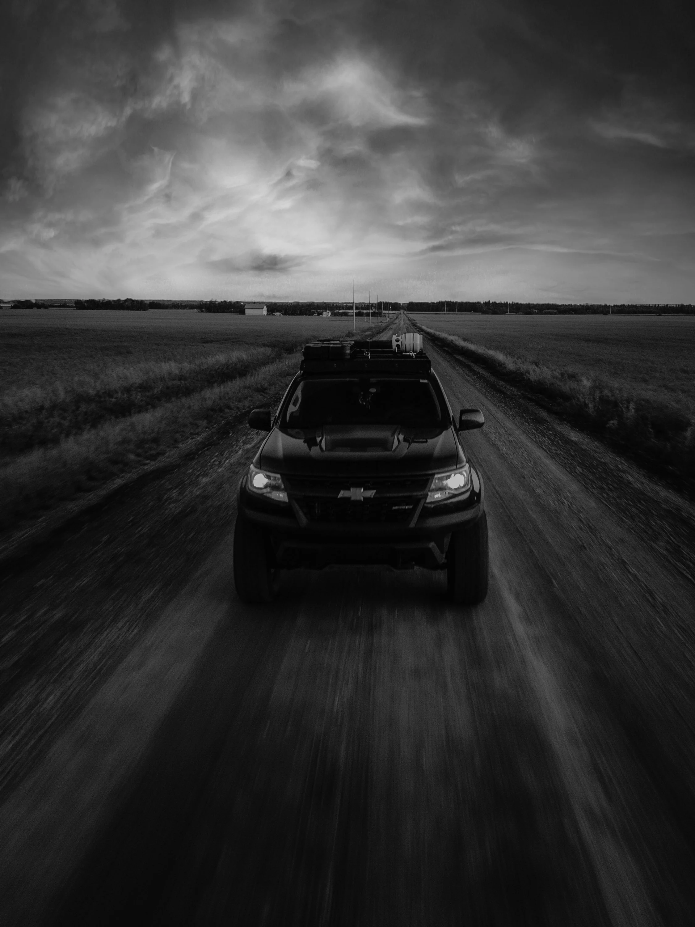 Chevrolet Colorado ZR2 driving down dirt road | Edmonton automotive photographer DarkShark Media