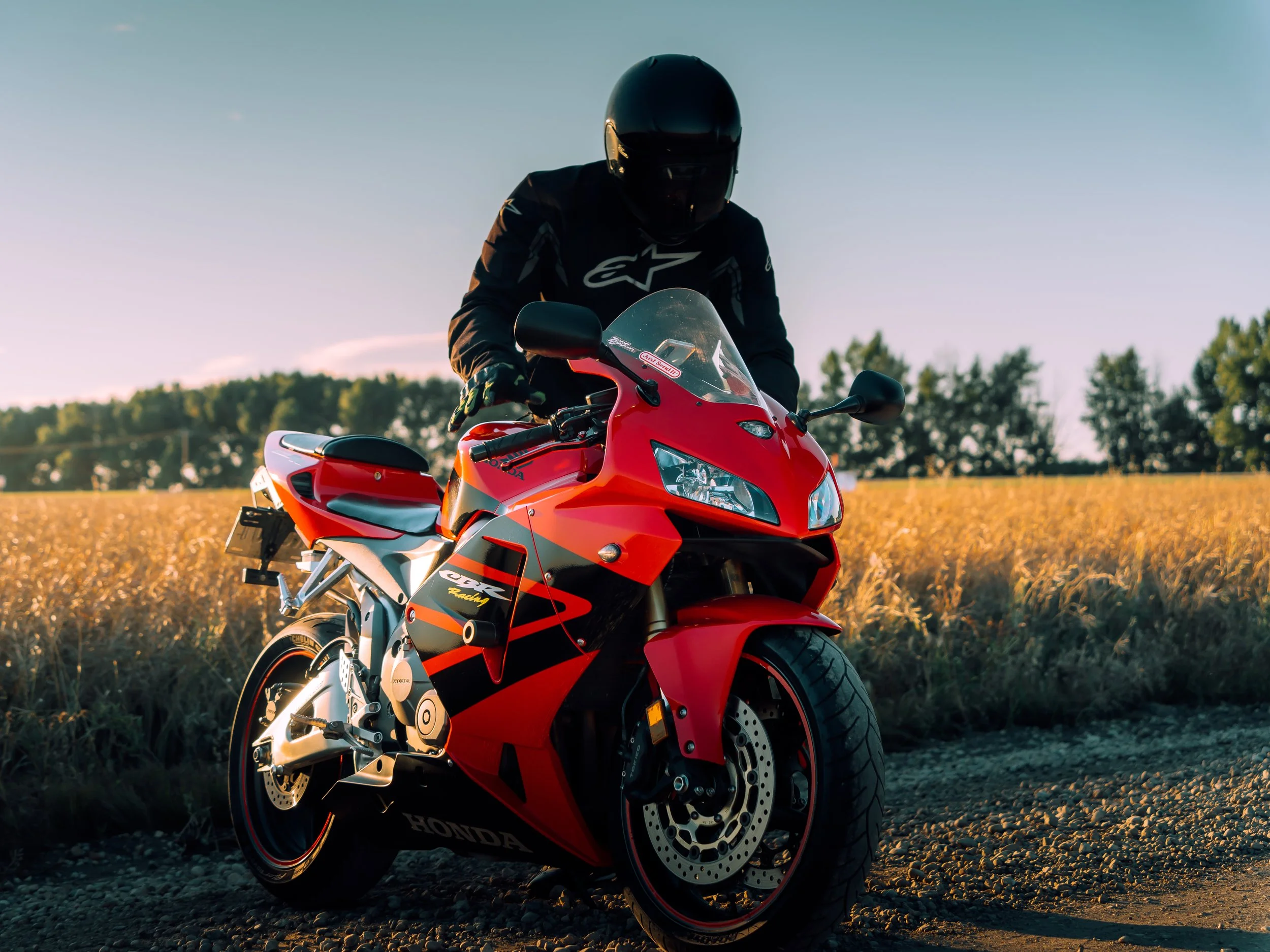 Rider dismounting Honda CBR motorcycle | Edmonton motorcycle photographer DarkShark Media