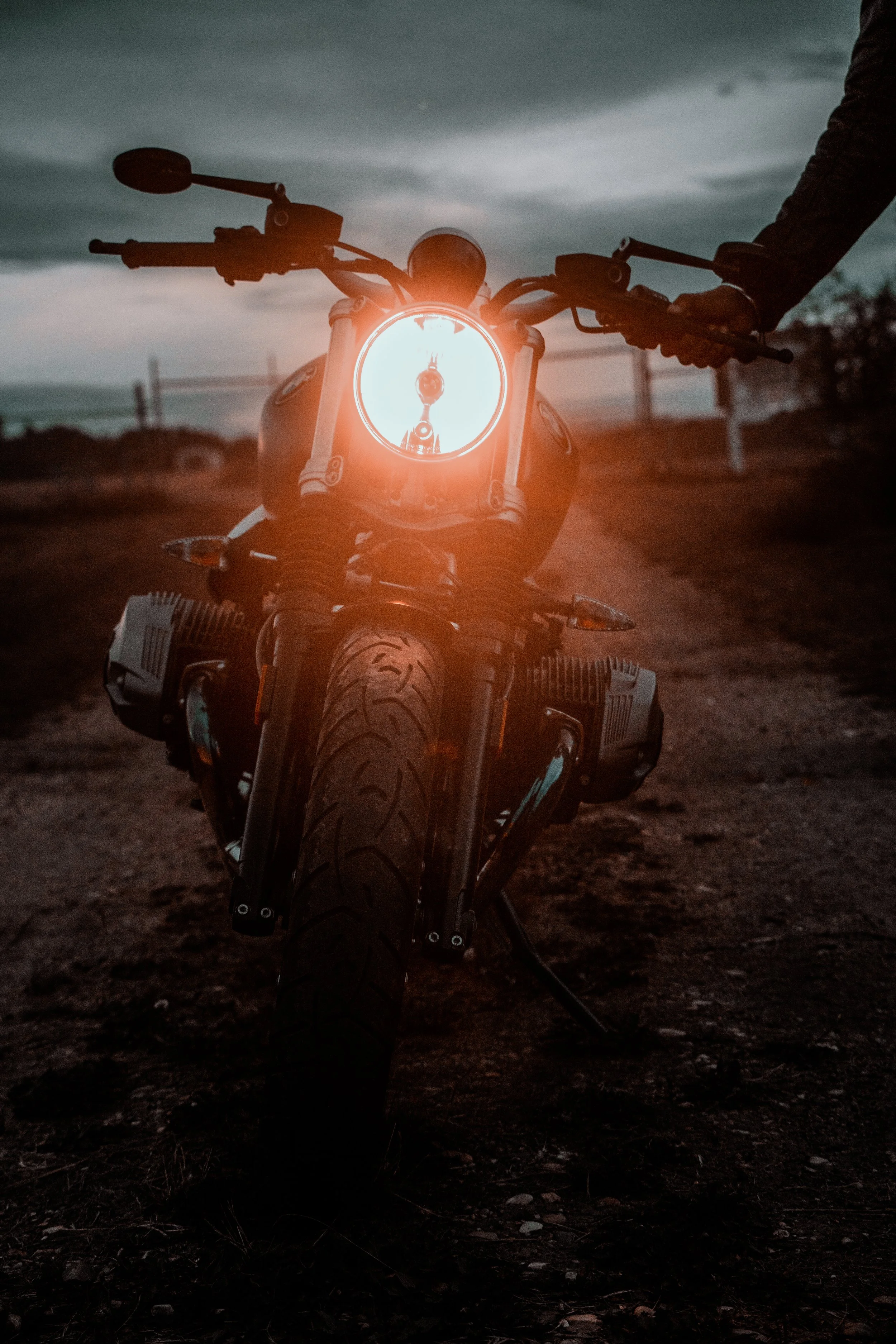 BMW R Nine T Motorcycle with headlight on | Edmonton motorcycle photographer DarkShark Media