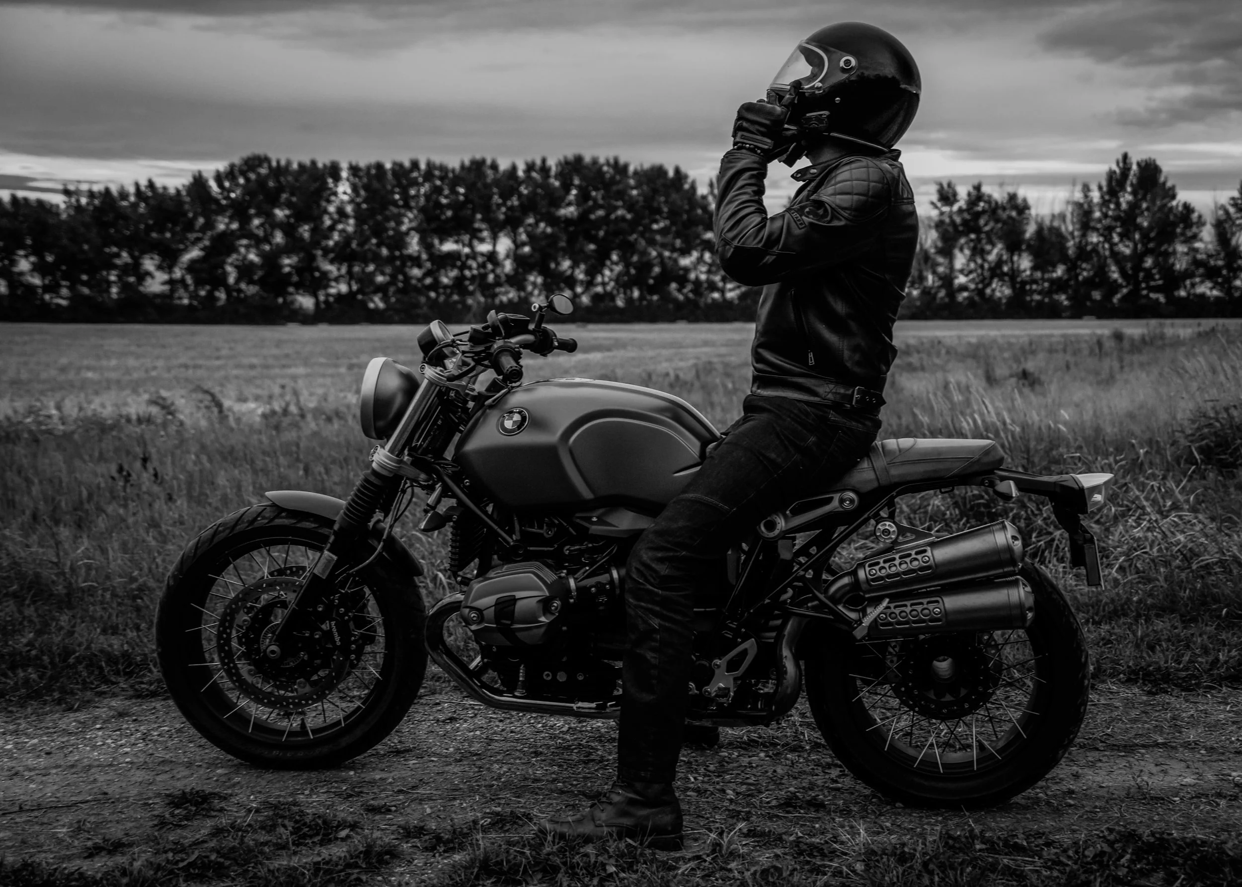 Man putting on motorcycle helmet Edmonton | Edmonton motorcycle photographer DarkShark Media