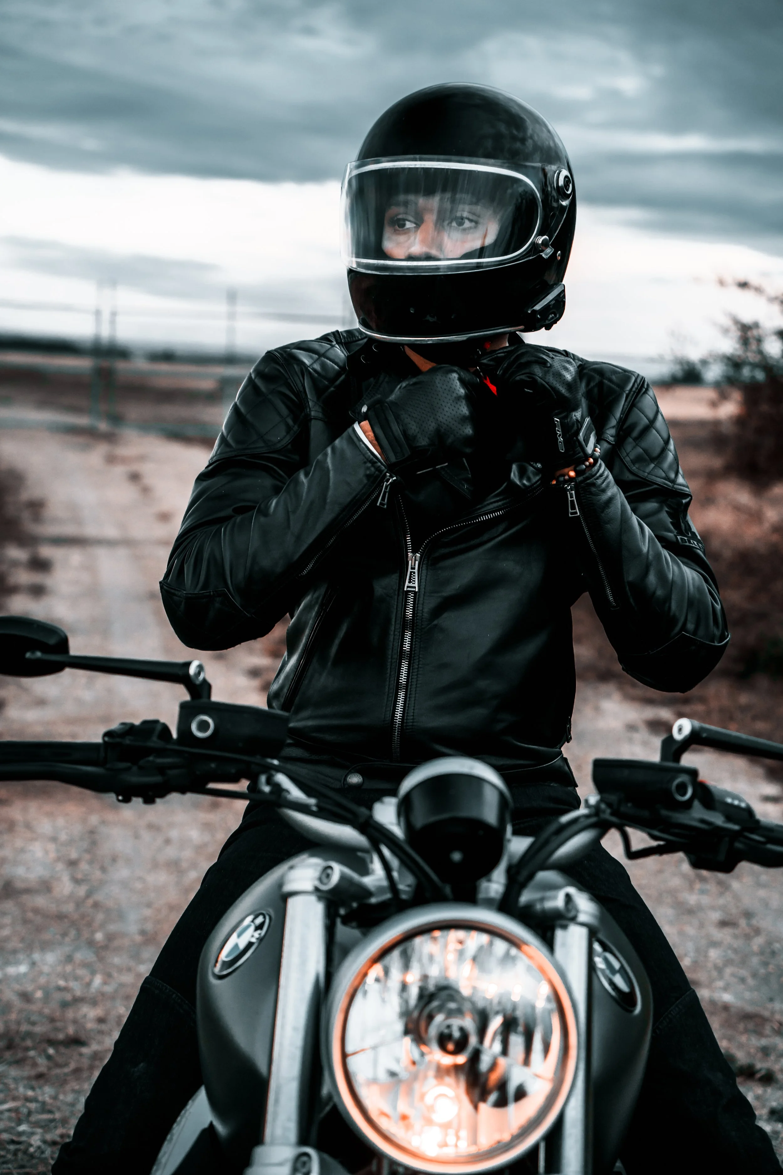 Motorcycle rider does up his helmet | Edmonton motorcycle photographer DarkShark Media