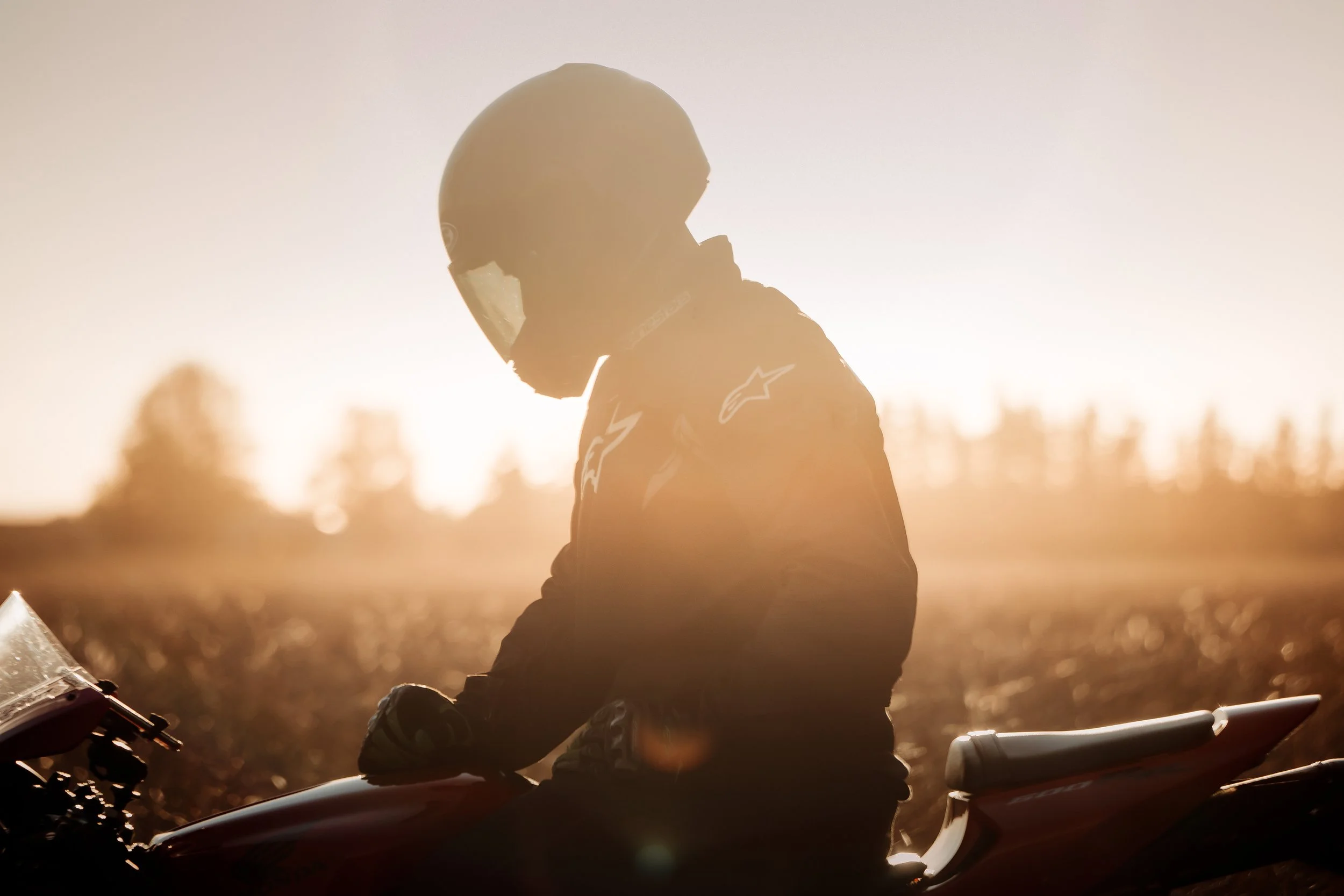 Backlit motorcycle rider at sunset | Edmonton motorcycle photographer DarkShark Media