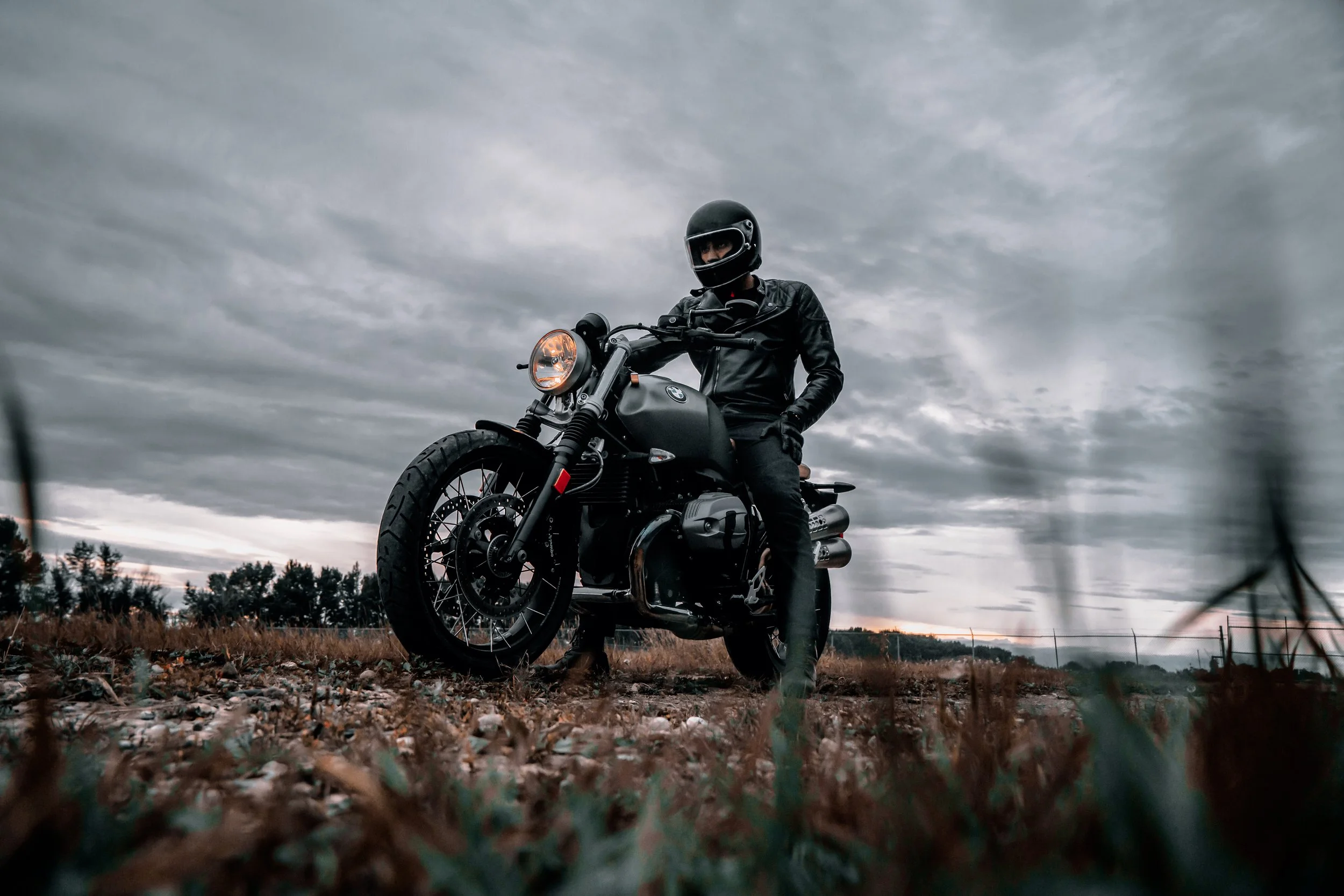 Motorcycle with man on it, as taken from ground level | Edmonton motorcycle photographer DarkShark Media