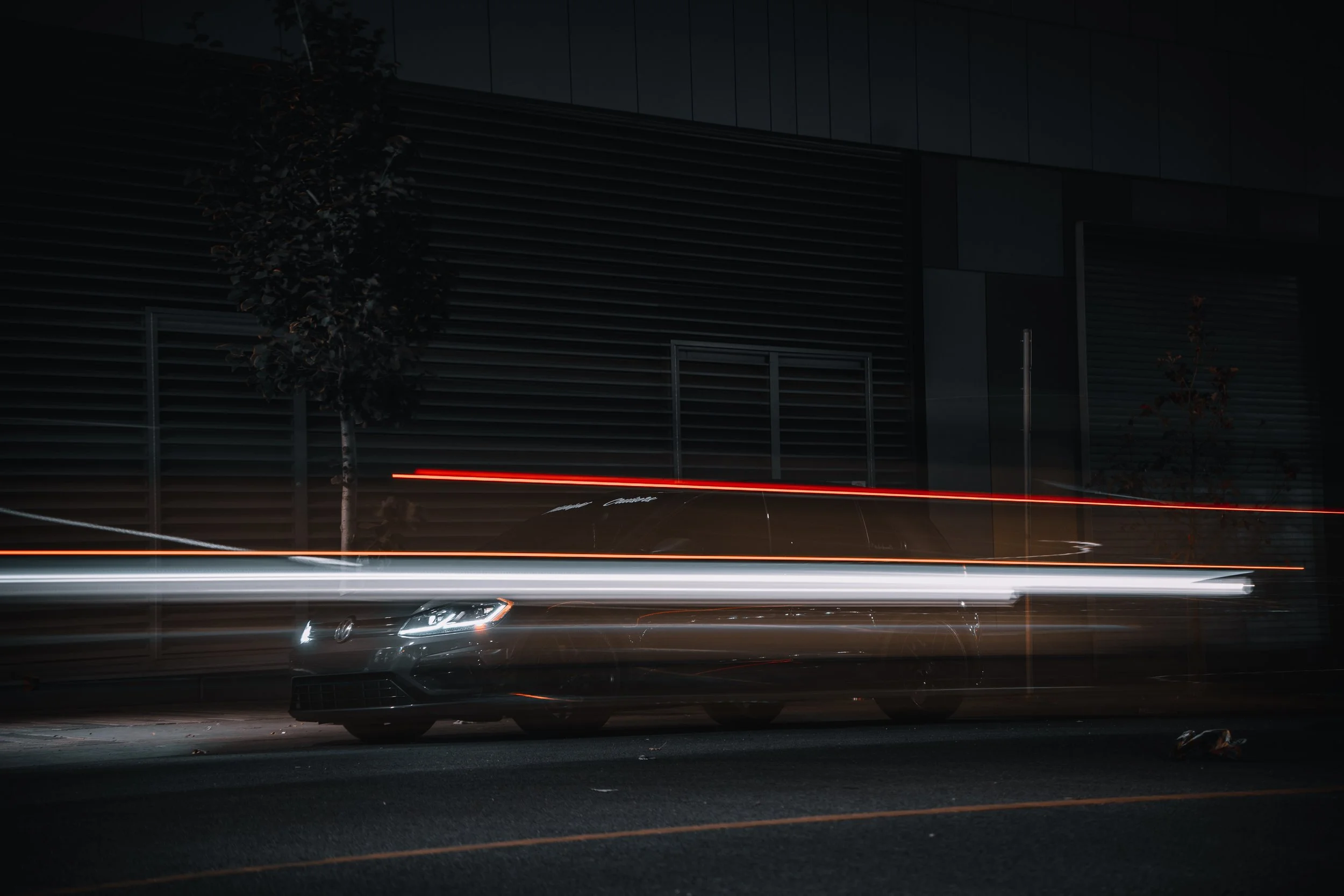 Volkswagen Golf with long exposure of traffic going past | Edmonton automotive photographer DarkShark Media