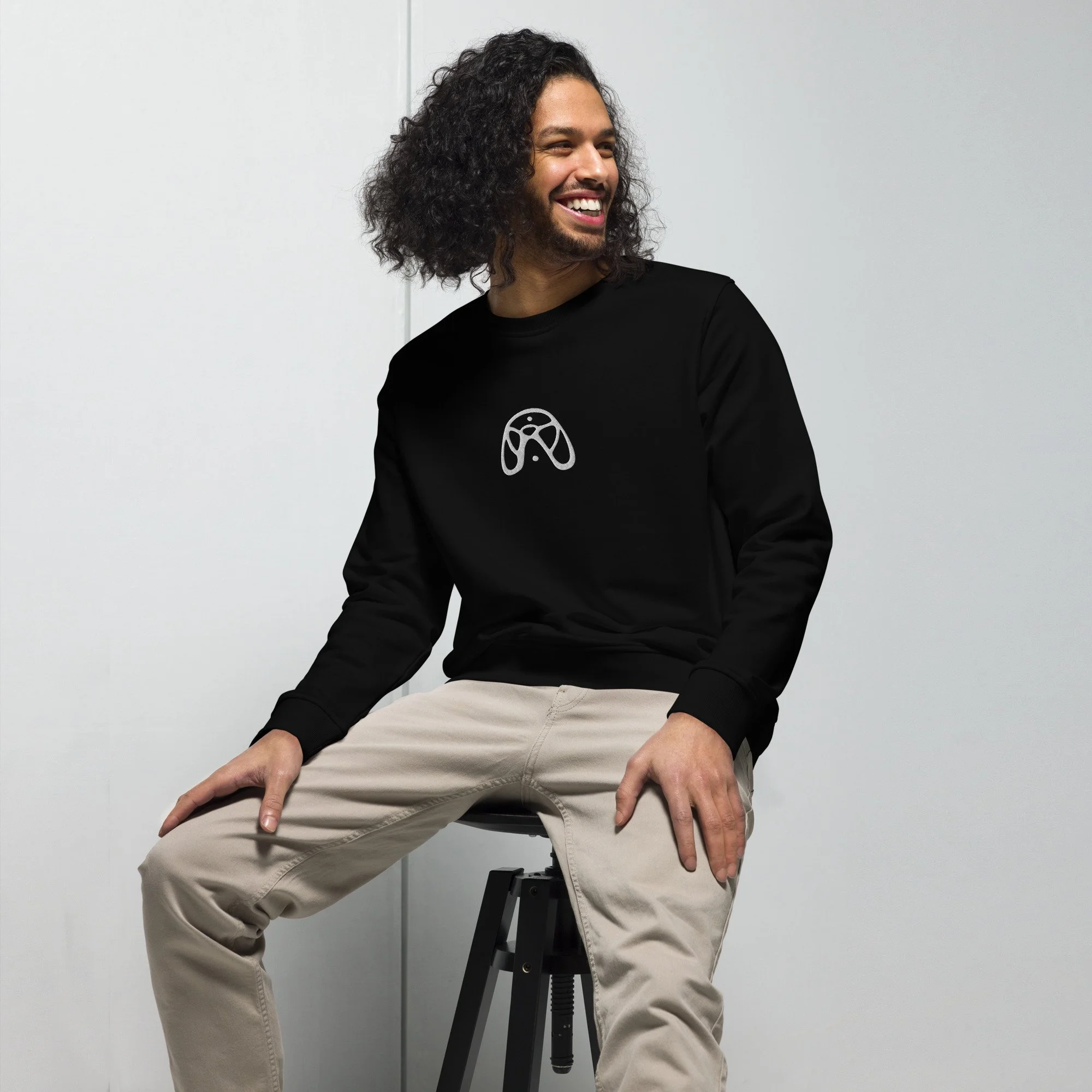 unisex-organic-sweatshirt-black-front-pentaclast-model-seat.jpg