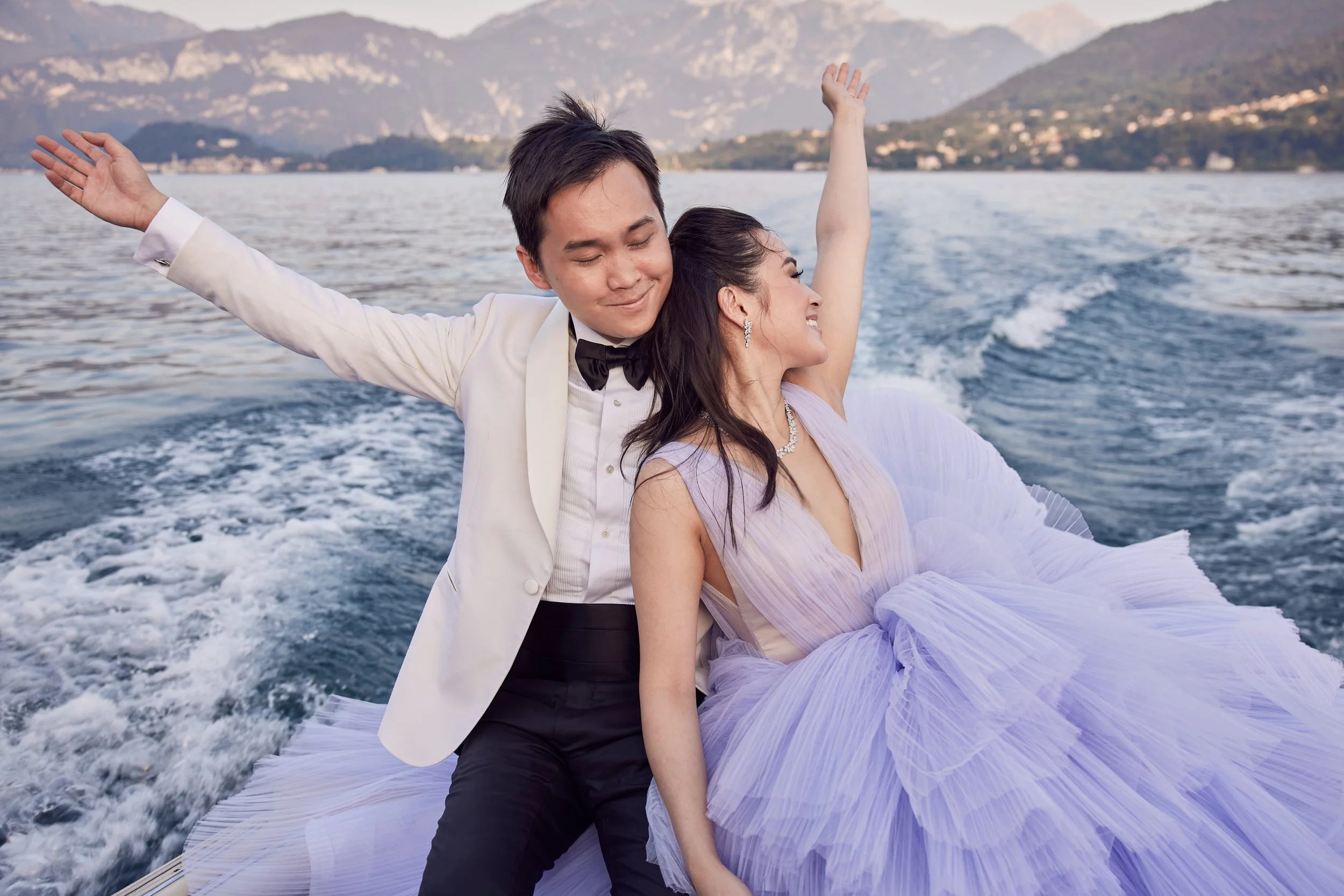 Sunset boat ride in Lake Como during luxurious engagement photoshoot with Lost in Love Photography.