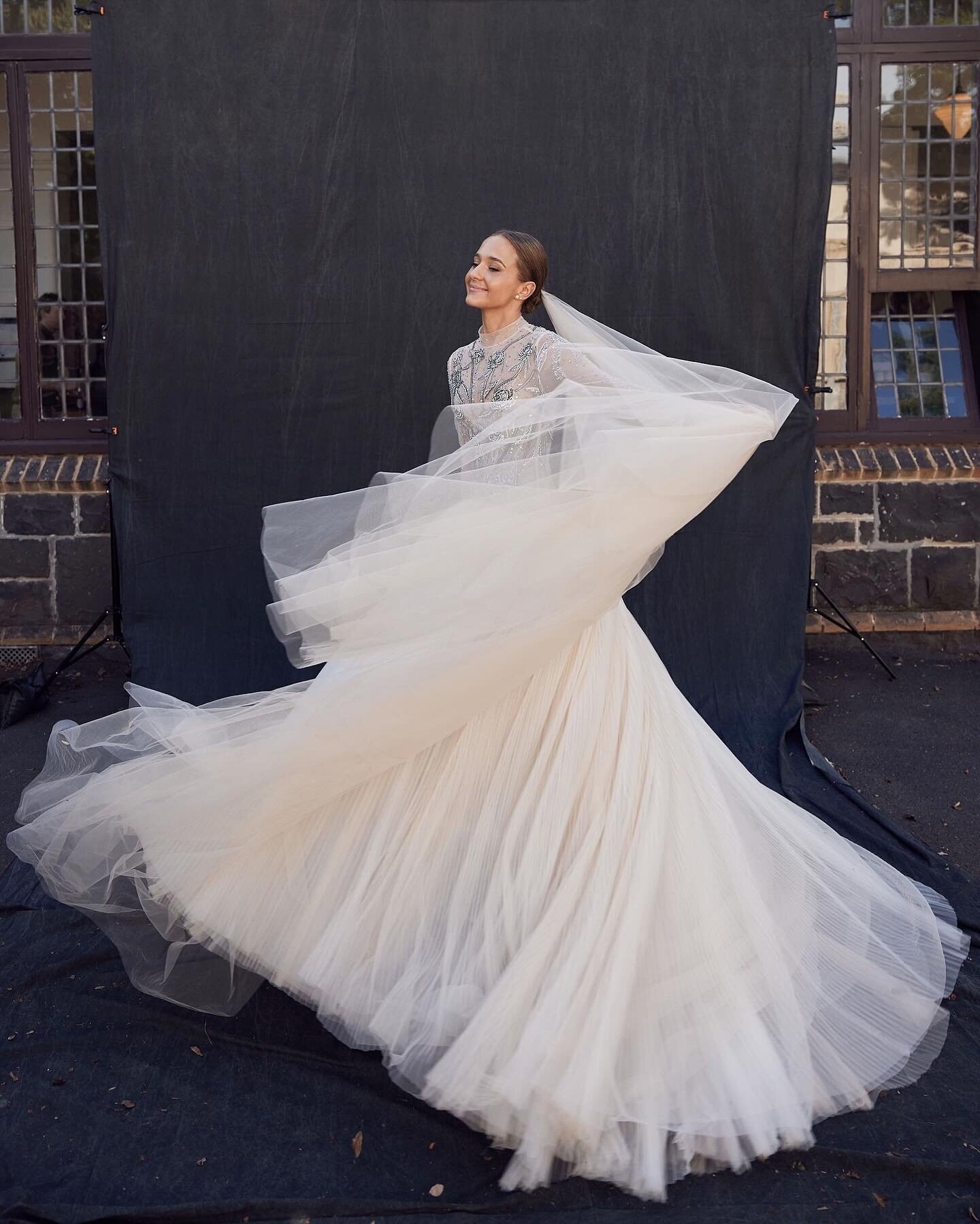 We are in love with Olivia and her custom gown by @kyhastudios as featured in Vogue 🤍 Our bride was an absolute vision in her blush tulle skirt paired with a sheer bodice adorned in hand beaded dripping roses

Bride | @oliviaburke_ @tom_lynch 
Photo