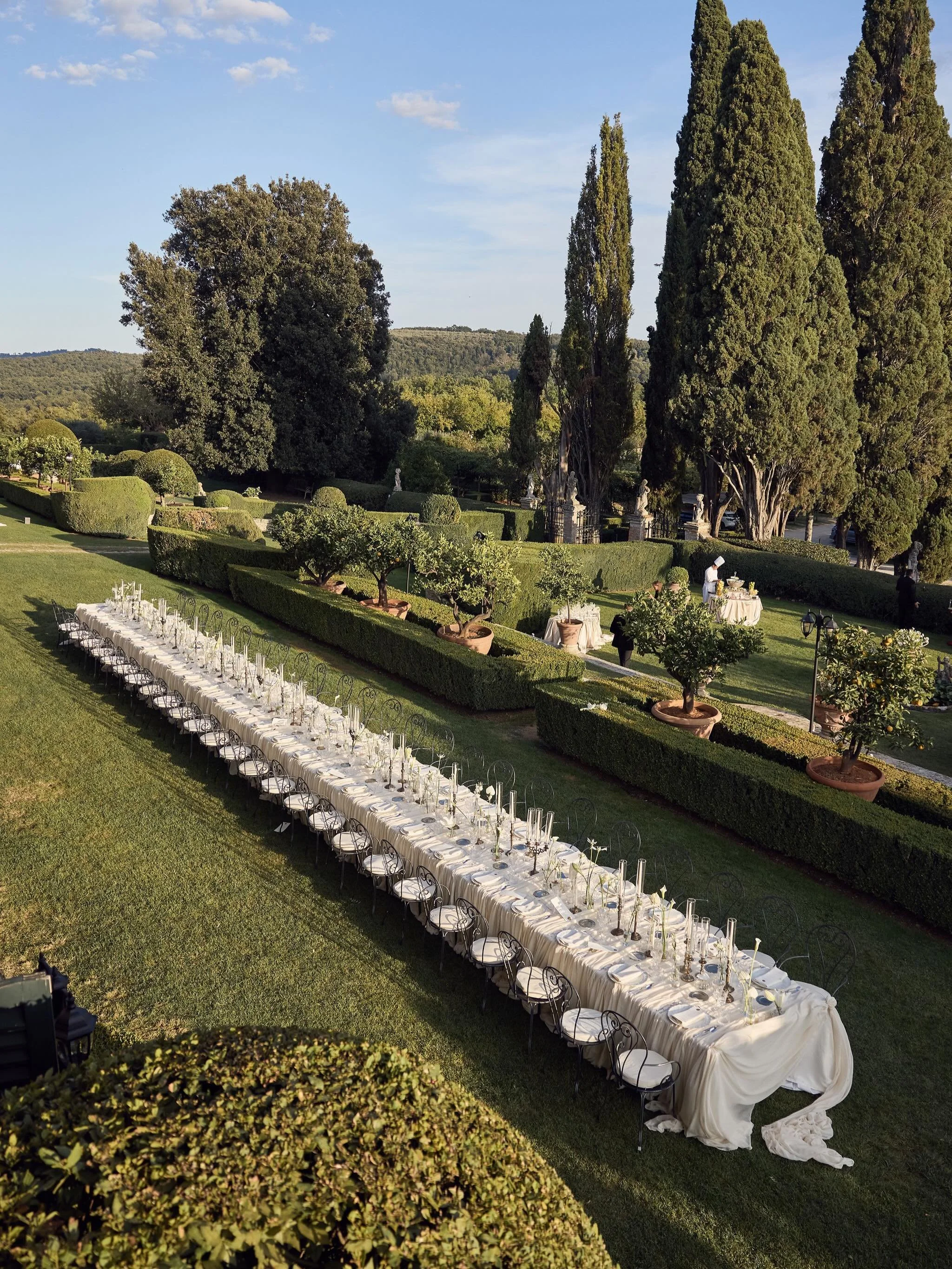 Four days in Tuscany. A venue booked unseen. Columns so beautiful Lauren knew this was her venue the moment she saw a photo of it. Lauren poured her heart into every styling detail from the fabric draped over ancient stone, the unique florals to the 