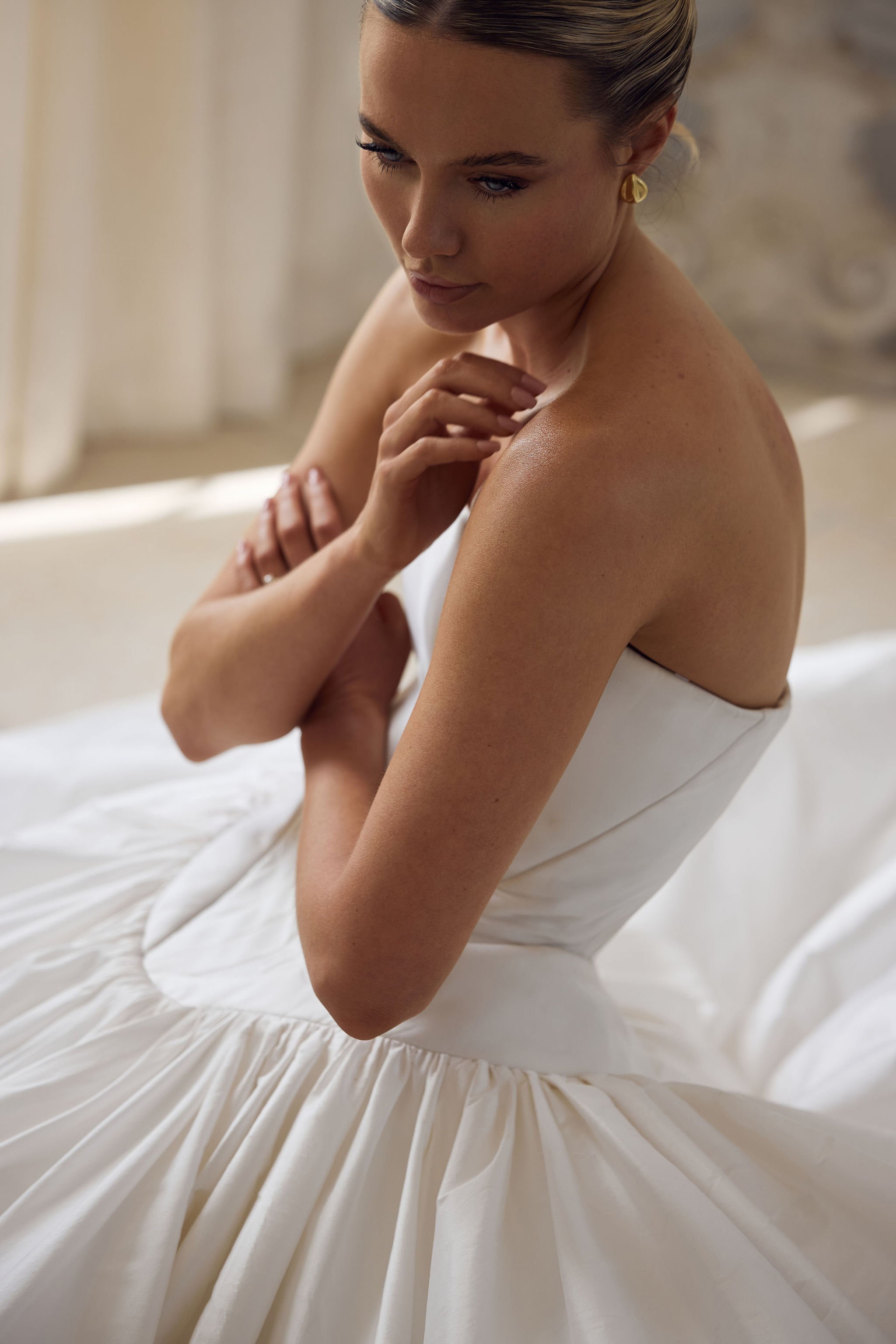 Editorial bridal portrait in strapless wedding gown and natural light