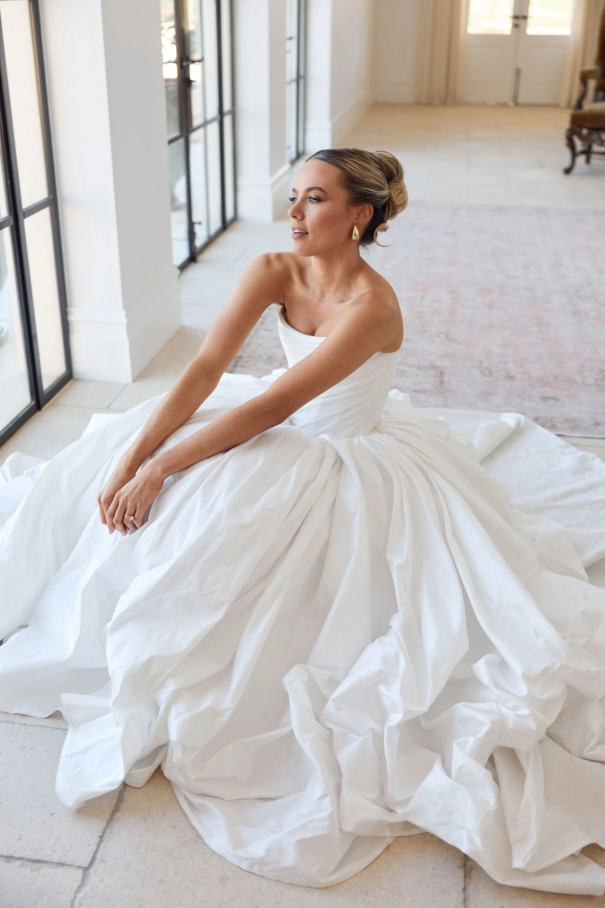 Editorial bridal portrait in strapless wedding gown and natural light
