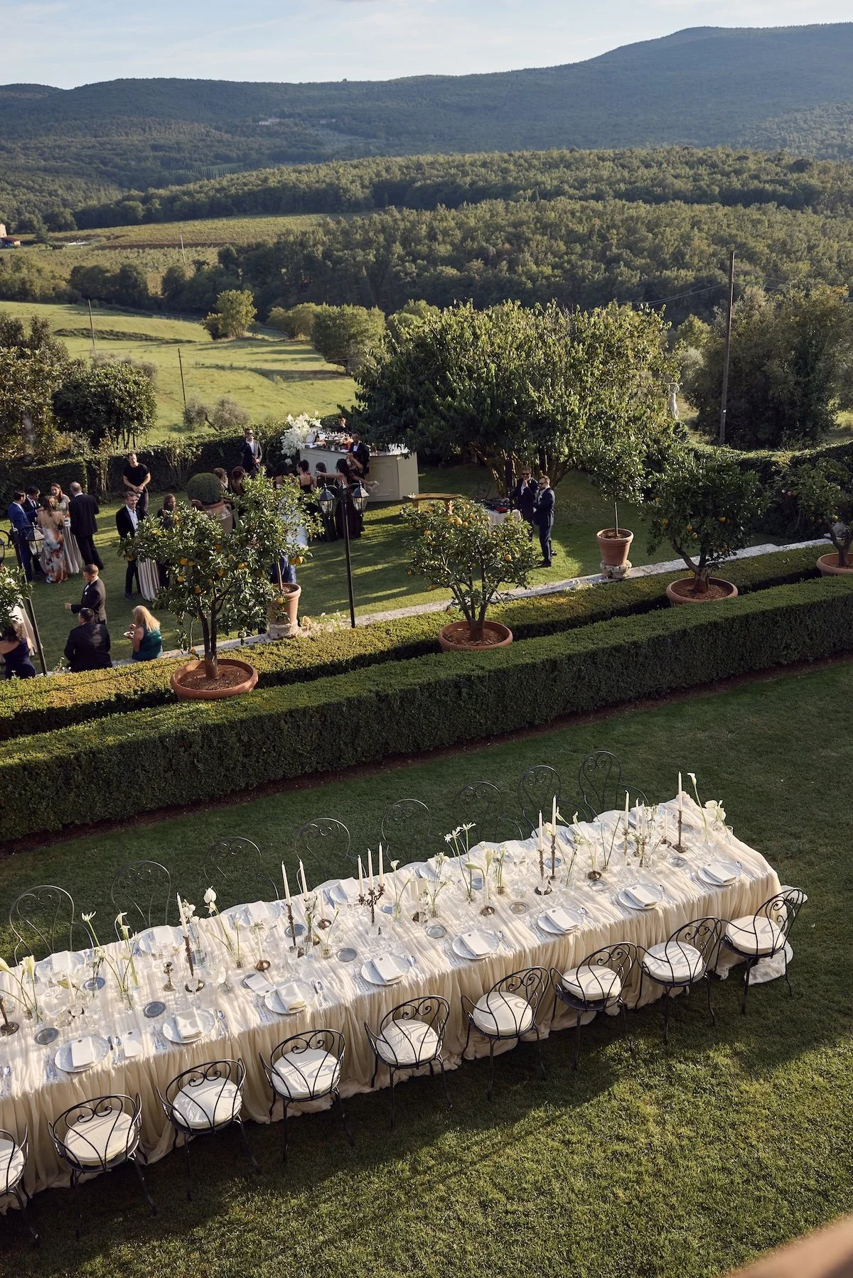 Long outdoor wedding reception in Tuscany, one of the best luxury wedding destinations captured by Lost in Love Photography