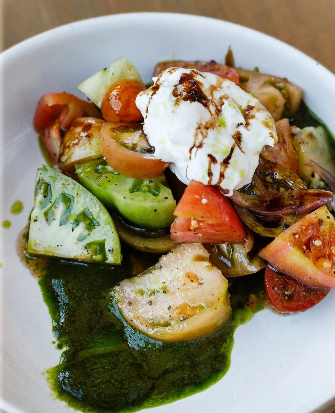 Heirloom tomatoes, burrata, hazelnut pesto, basil, saba 🍅