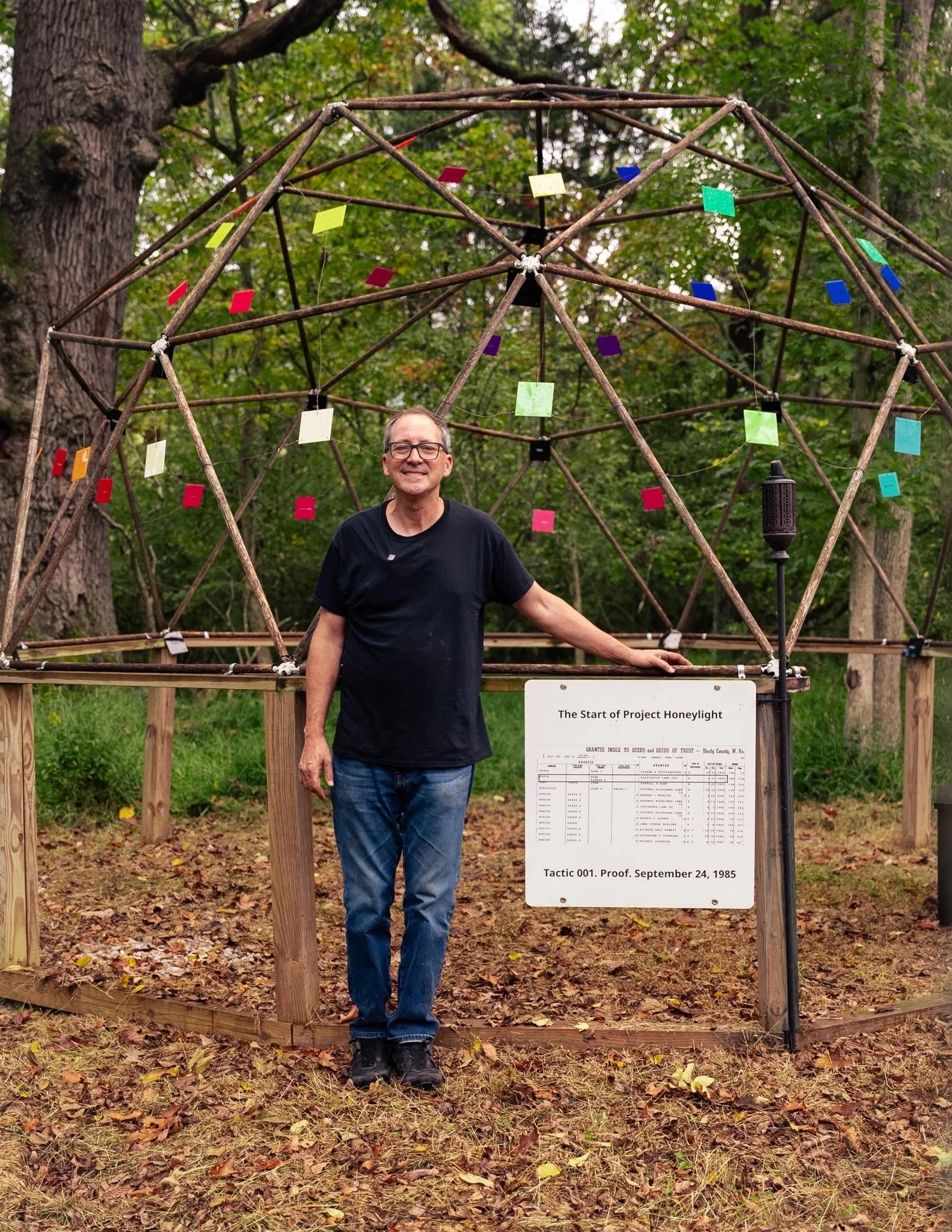 Mark Rubin at the Dome of Dreams beside the Hardy County deed index recording his 1985 land purchase.