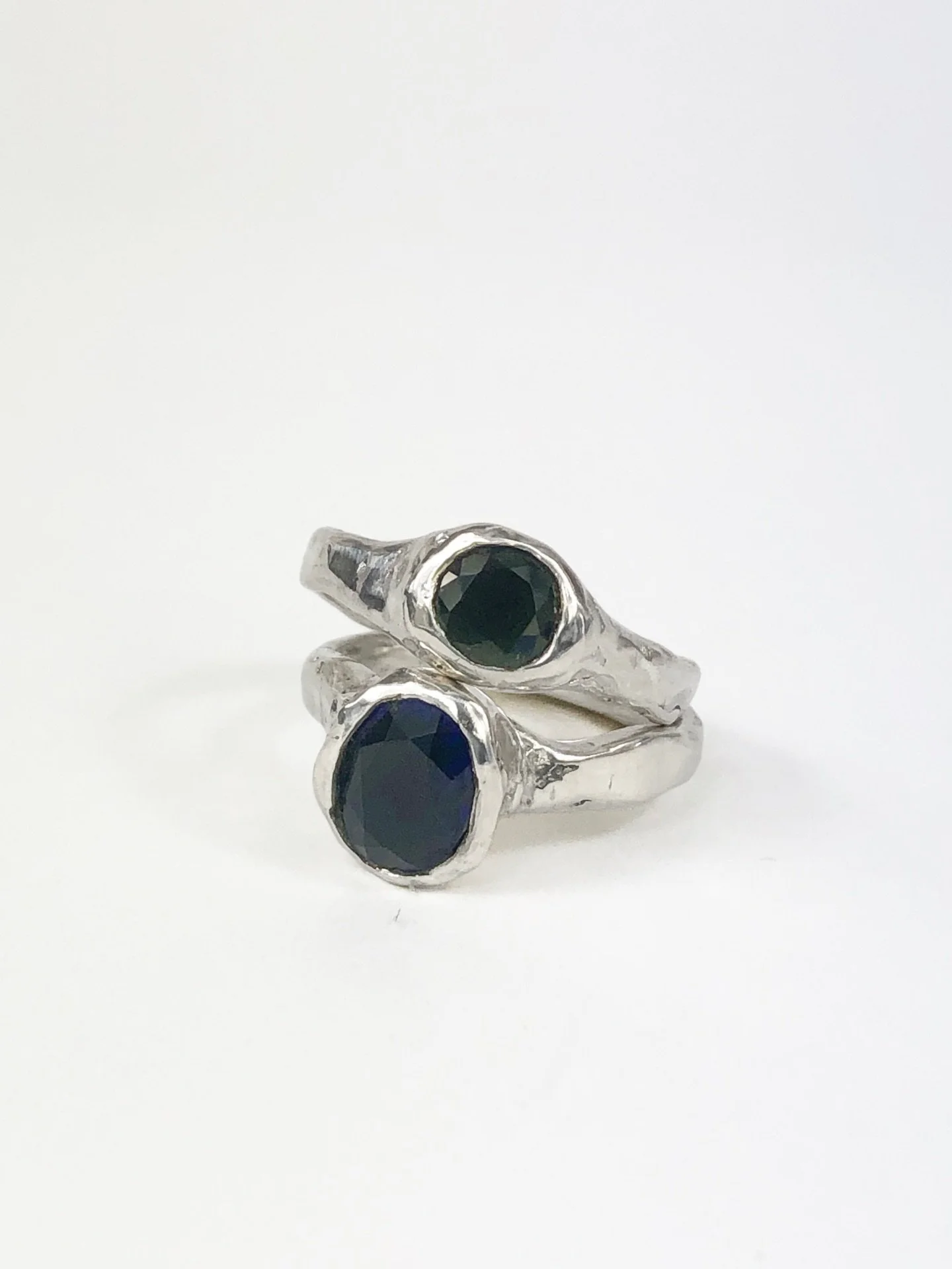 | Deep Hues |

Blue &amp; green sapphires encased in hand carved silver bands.  One of a kind. 
.
.
.
#sapphirelove
