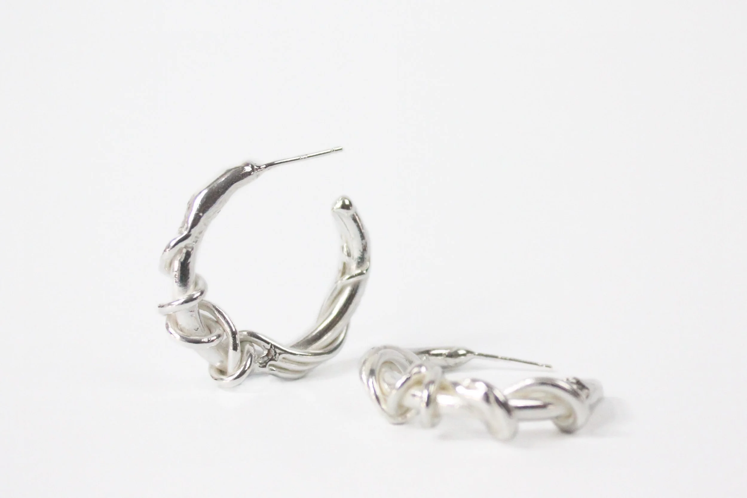 The Viney hoops.

Coiling and twisting vines surrounding a statement hoop.

Also available in the Viney bangle.
.
.
.