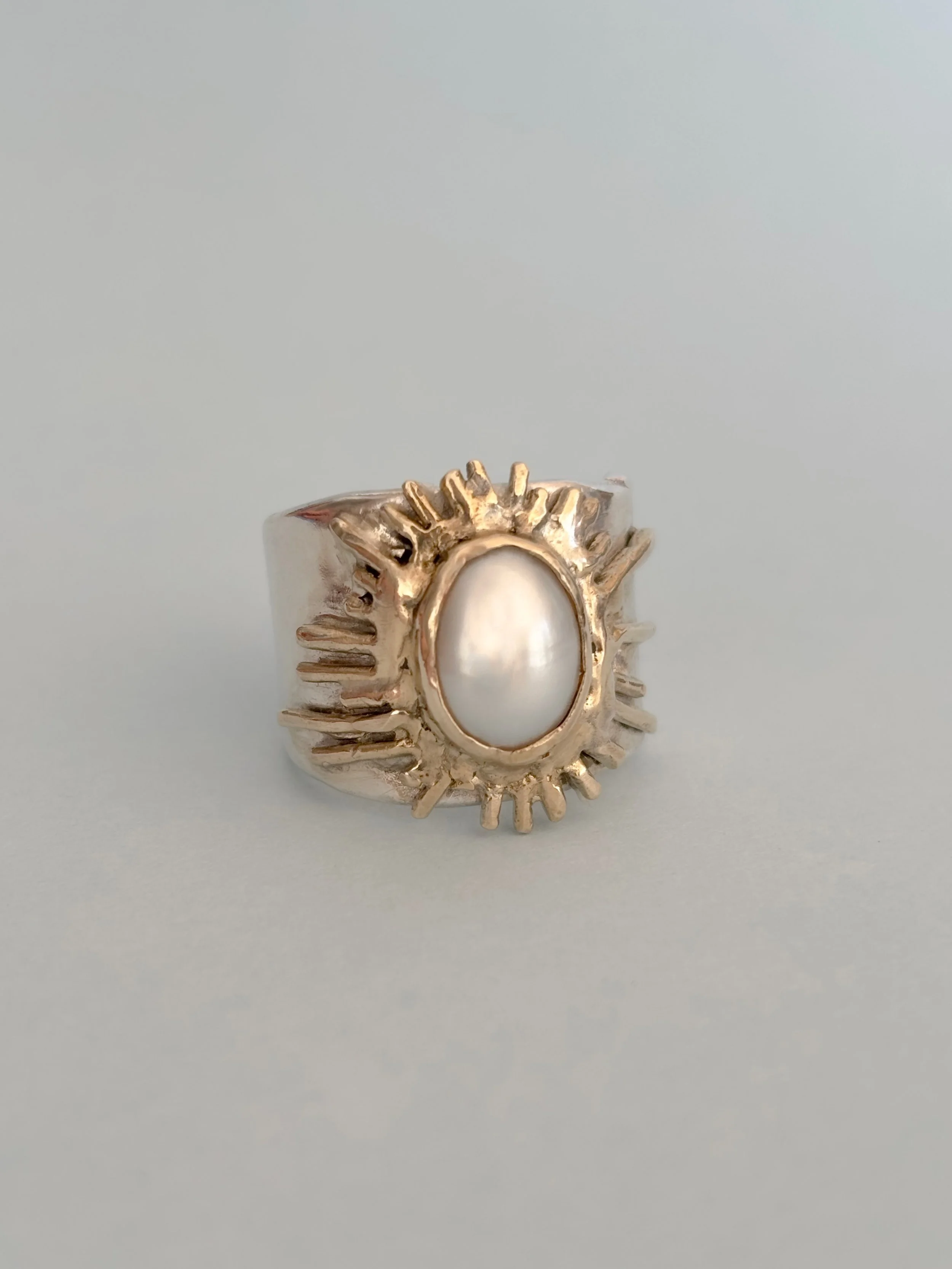 BESPOKE | Sunburst. 

The statement ring for those who love to bring a little sunshine wherever you go. 

Mixed metals &amp; oval set freshwater pearl. 

Just in time for summer xx