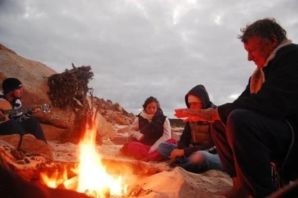 Crew of Tearaway enjoying a campfire while cruising Australia