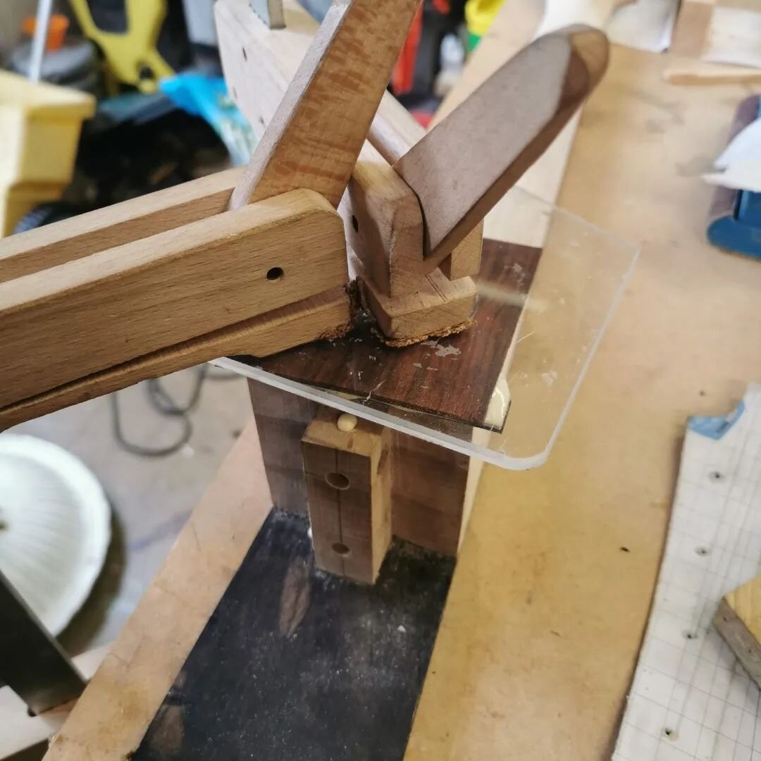 Glueing the heel cap. I like to use a piece of clear acrylic plexiglass so I can be sure the grain lines are straight and it doesn't move under clamping pressure