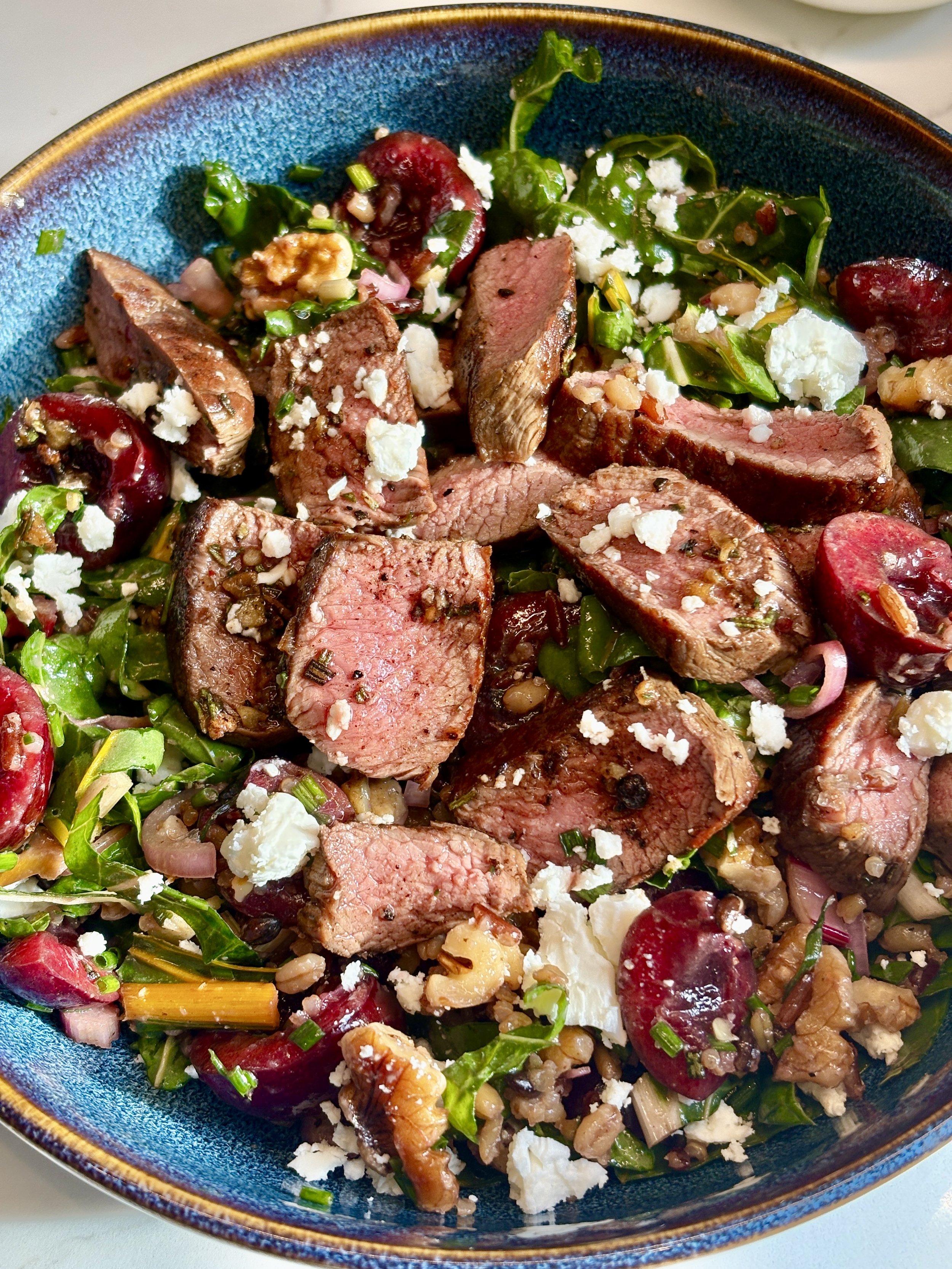 Pan-Fried Juniper &amp; Pink Peppercorn Venison Steaks with a Cherry, Chard &amp; Feta Grain Salad